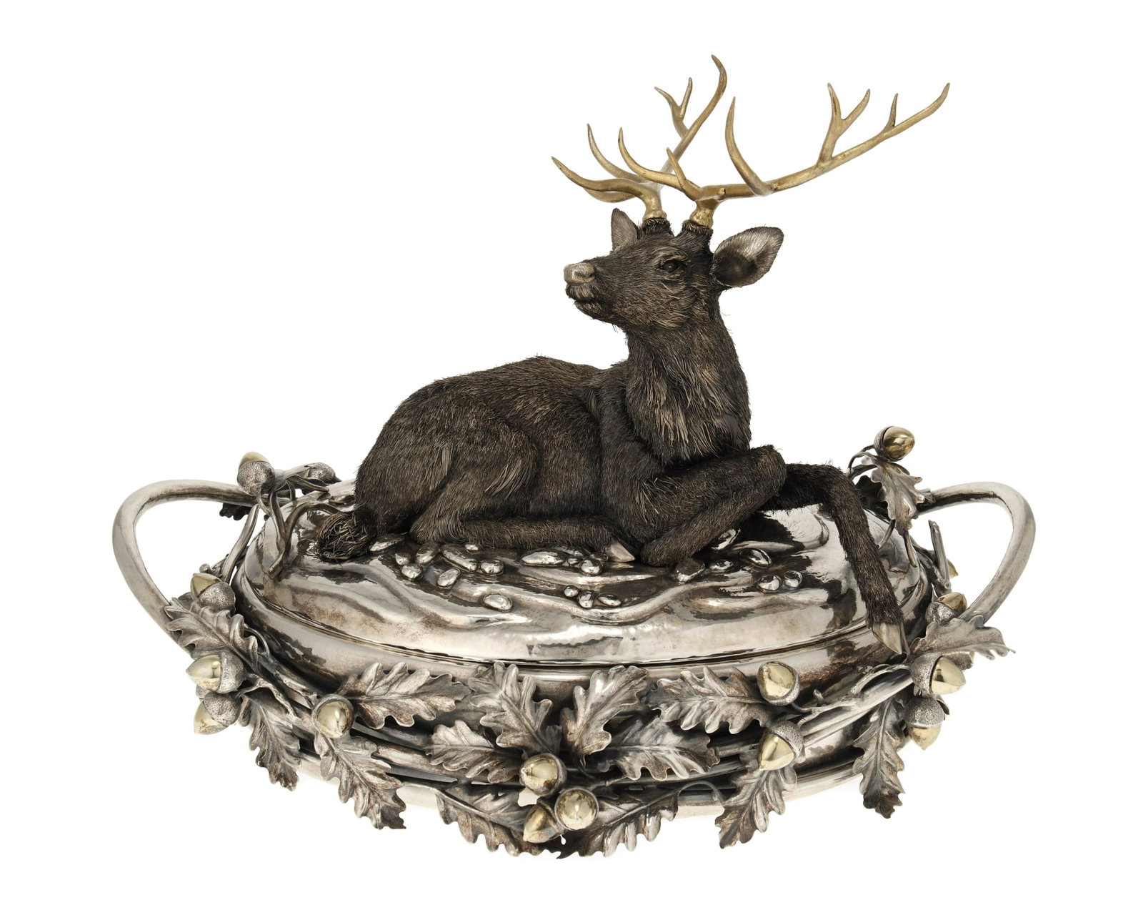 A Fratelli Lisi e Figli sterling silver stag centerpiece: Third-Quarter 20th Century Marked: Lisi [Fratelli Lisi e Figli] / 925 / [partial illegible Italian hallmark for Florence] The sterling silver covered centerpiece surmounted by a seated stag with gilt 