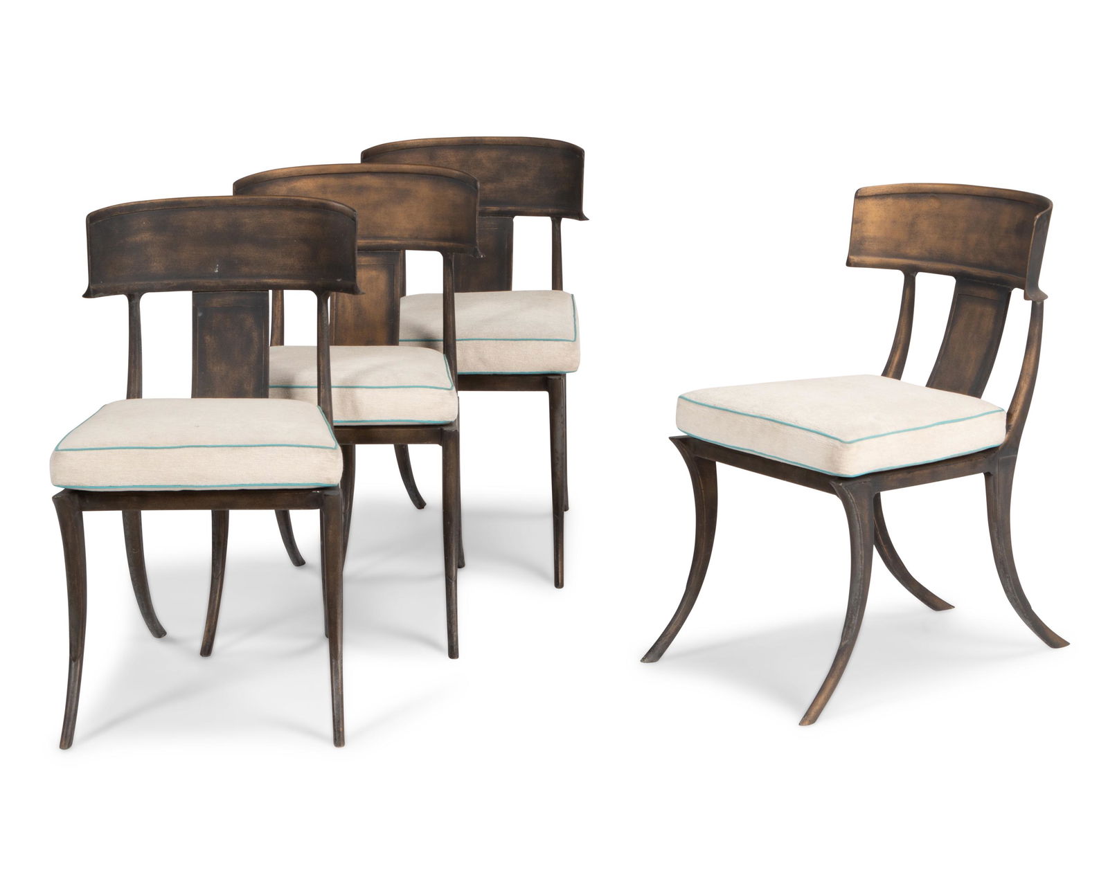 A set of Michael Taylor klismos outdoor garden side chairs: Late 20th/Early 21st Century In the style of T. H. Robsjohn-Gibbings, each cast aluminum with a weathered bronze finish with cream chenille upholstered cushions and aqua piping, 4 pieces Each: 34.5"