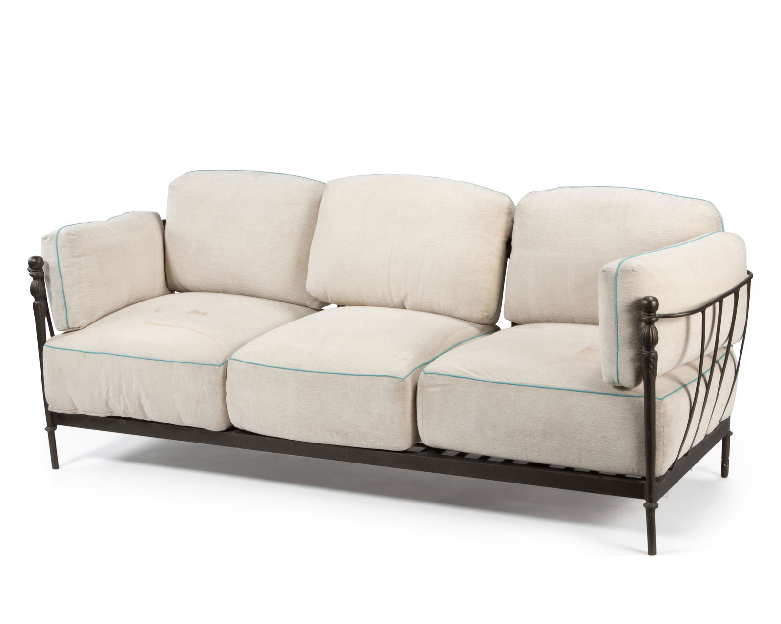 A Michael Taylor "Montecito" outdoor garden sofa: Late 20th/Early 21st Century The patinated aluminum sofa with cream chenille upholstered cushions with aqua piping 37" H x 95" W x 37" D Provenance: The Residential Property of Thomas and Erika Gi
