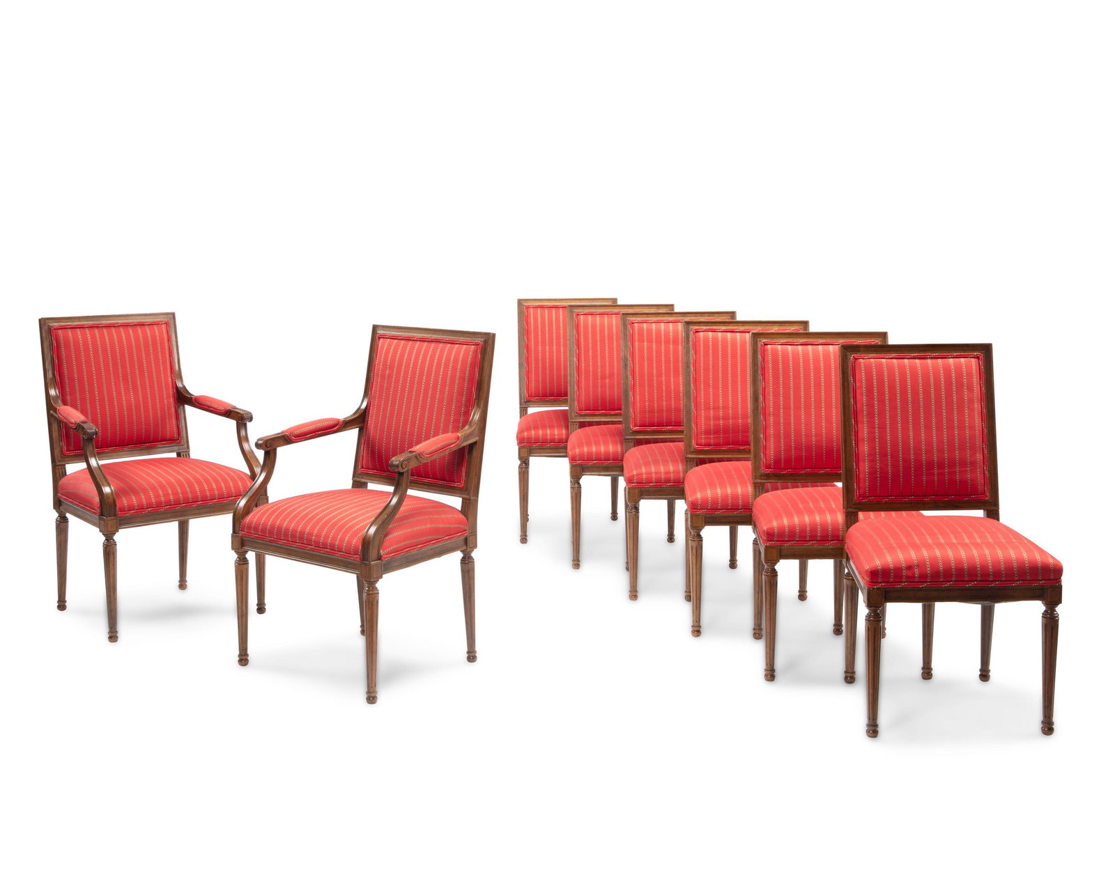 A set of Louis XVI-style dining chairs: 20th Century Each with carved wood frames and red silk stripe upholstery, comprising two armchairs and six side chairs, 8 pieces Each armchair: 38.125" H x 23" W x 19" D; each side chair: 37" H x 20" 