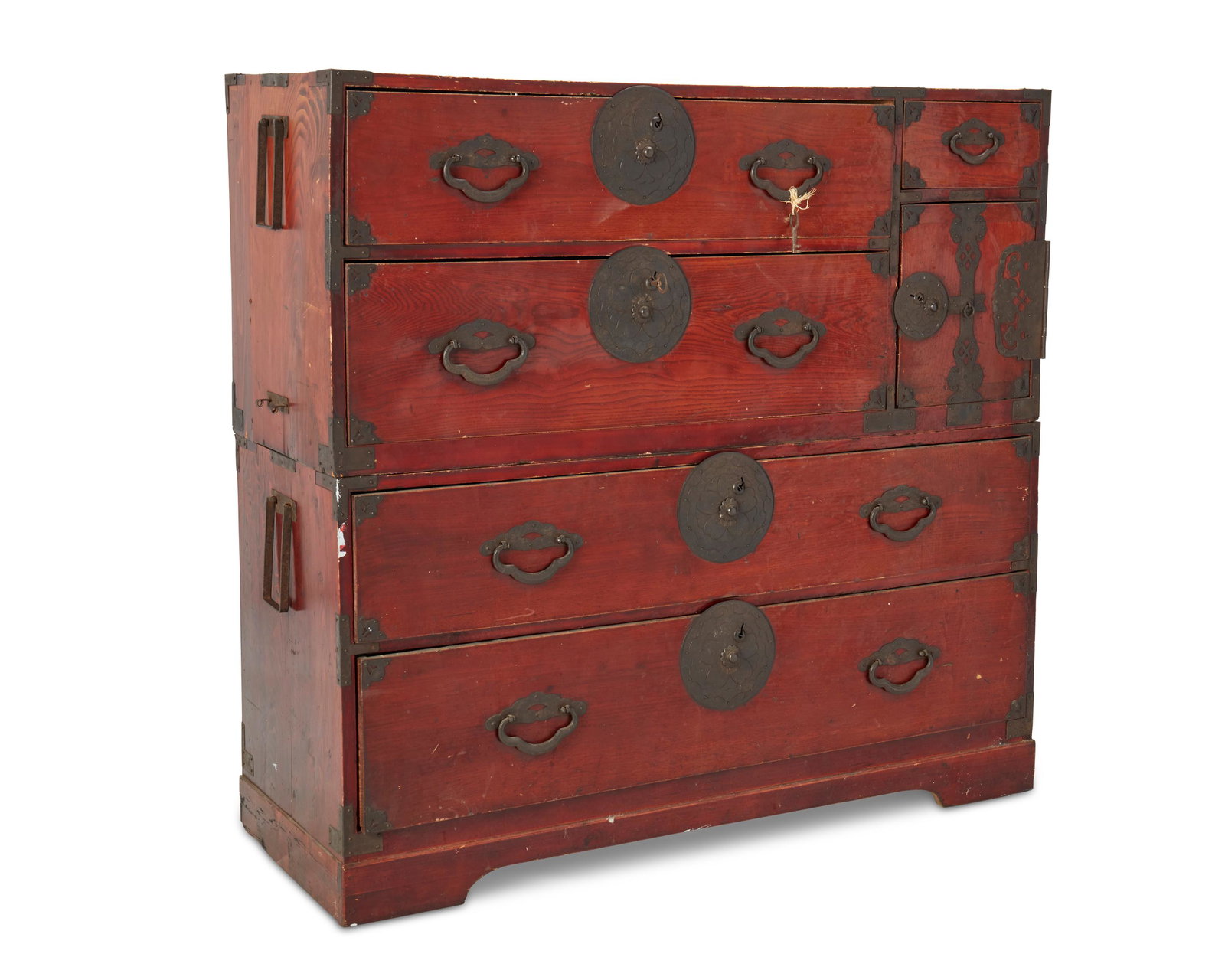 A Japanese stacked tansu chest: 20th century The two stacked chests with drawers and cabinets fitted with iron hardware and handles 43.25" H x 45" W x 16.75" D