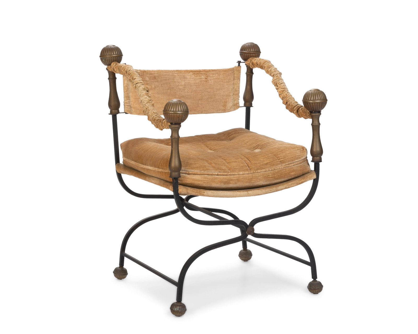 An Italian Savonarola-style chair: 20th century The brass and iron side chair with beige velvet seat and curule-style legs 33.5" H x 24" W x 21" D
