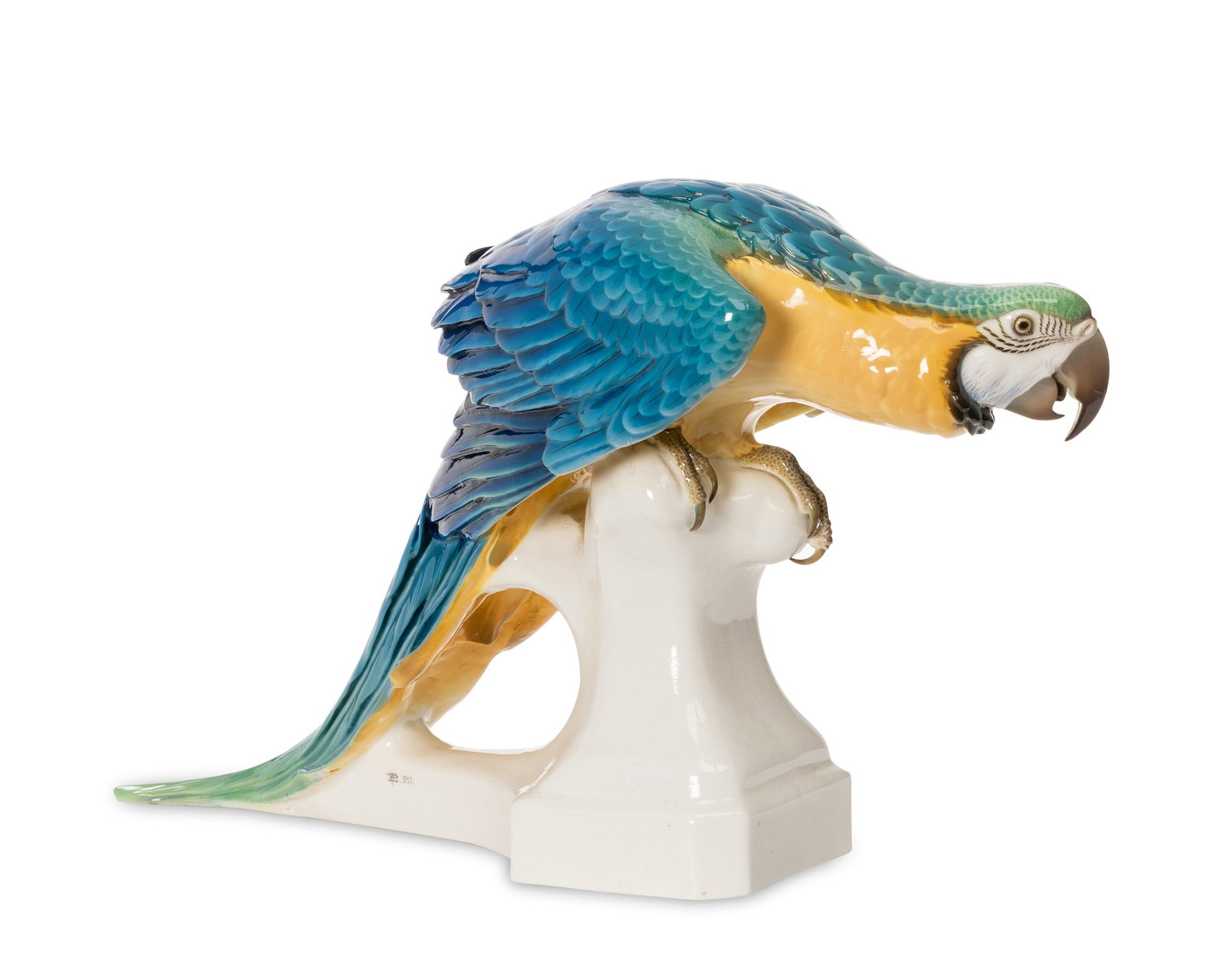 A large Nymphenburg macaw porcelain figure: Circa 1913 Marked with impressed Nymphenburg shield and numbered "3641" to underside; impressed "T Karner" with artists cipher and dated 1913 to side Designed by Theodor Karner, the glazed porcelain m