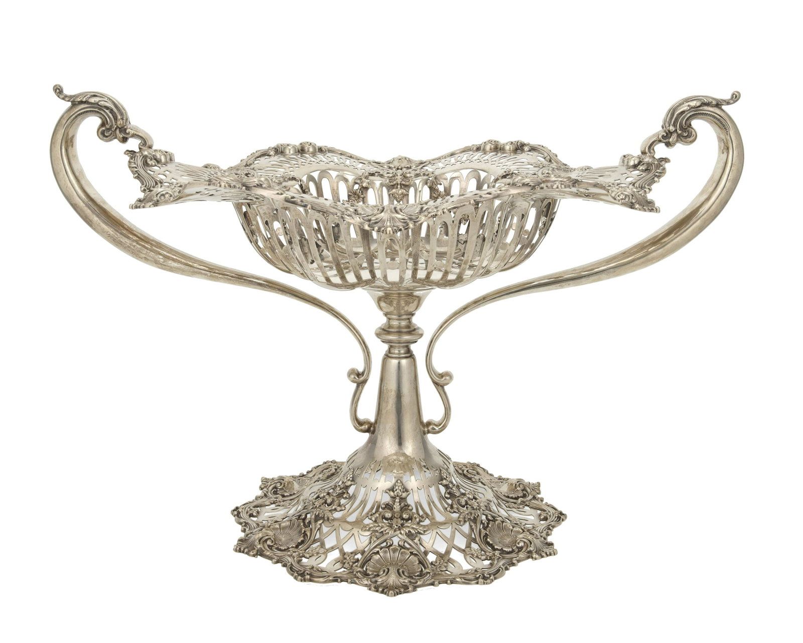 An American sterling silver centerpiece dish: Late 19th/Early 20th century Marked for Black, Starr & Frost and sterling; numbered: 5241 The large footed centerpiece bowl with abundant reticulated designs, rocaille motifs, and floral festoons flan