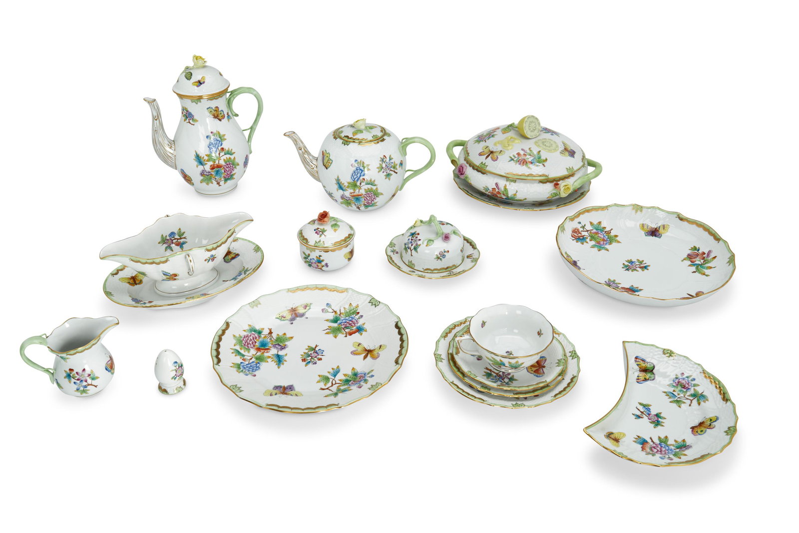 A Herend "Queen Victoria" porcelain dinner service: Late 20th century Each marked with blue overglaze Herend backstamp Each decorated with butterflies and floral sprays with green and gilt edges, comprising 1 teapot (6"), 1 coffee pot (10.25"), 1 mini 