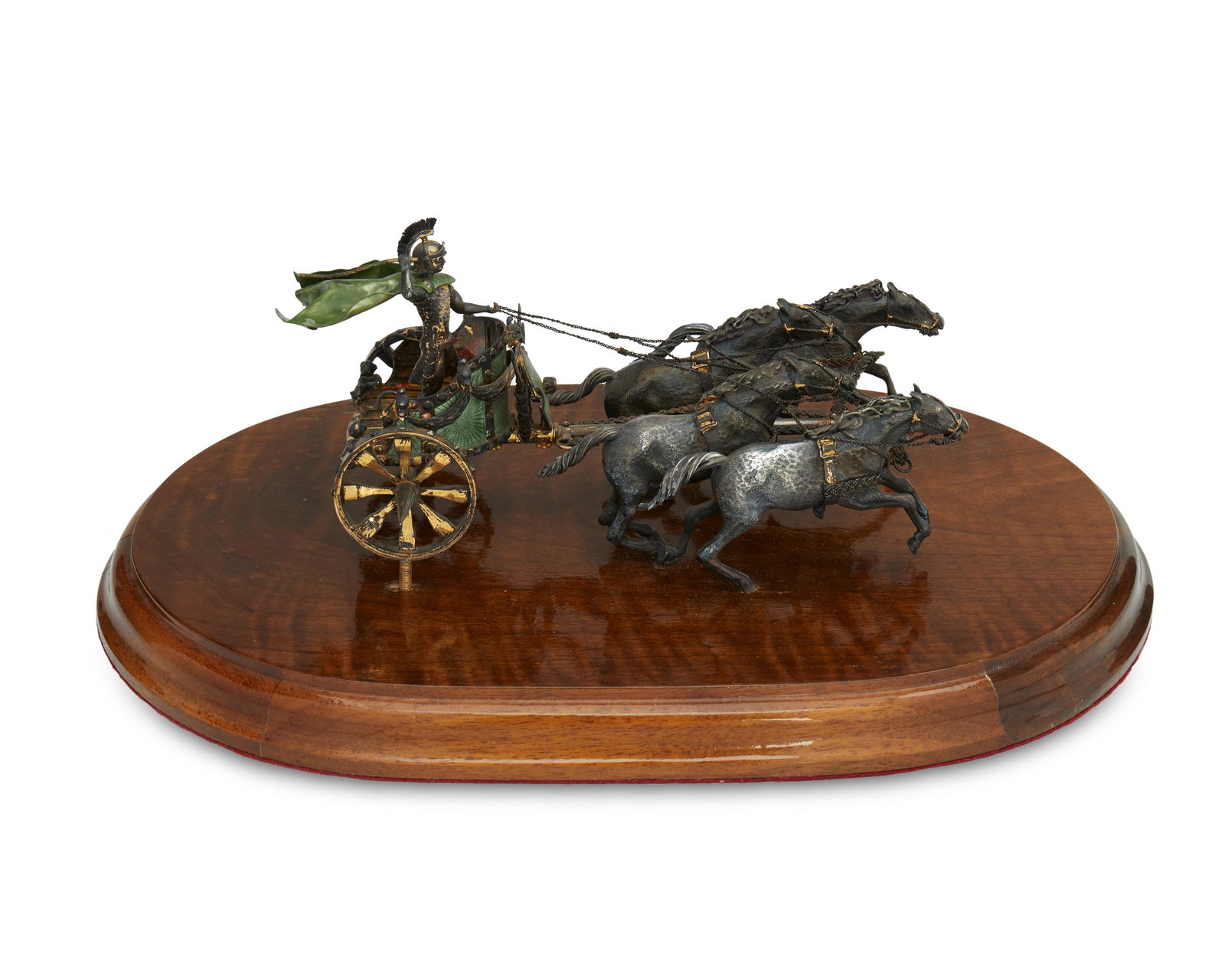 A Continental sterling silver and enamel sculpture: 20th century Marked: 925 Depicting a chariot with driver and four horses with guilloche enamel details, mounted on a wood base Overall: 6" H x 17.5" W x 12" D