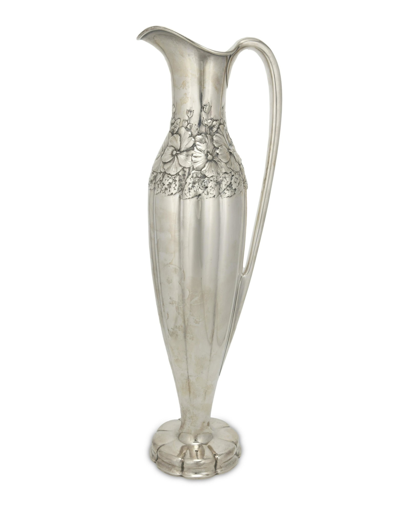A Tiffany & Co. sterling silver ewer vase: Circa 1907-1947, directorship of John C. Moore II Marked: Tiffany & Co. / 16710 A Makers 1160 / Sterling Silver / 925-1000 / M The handled vase or ewer with a tall, gadrooned body with a band of hibis