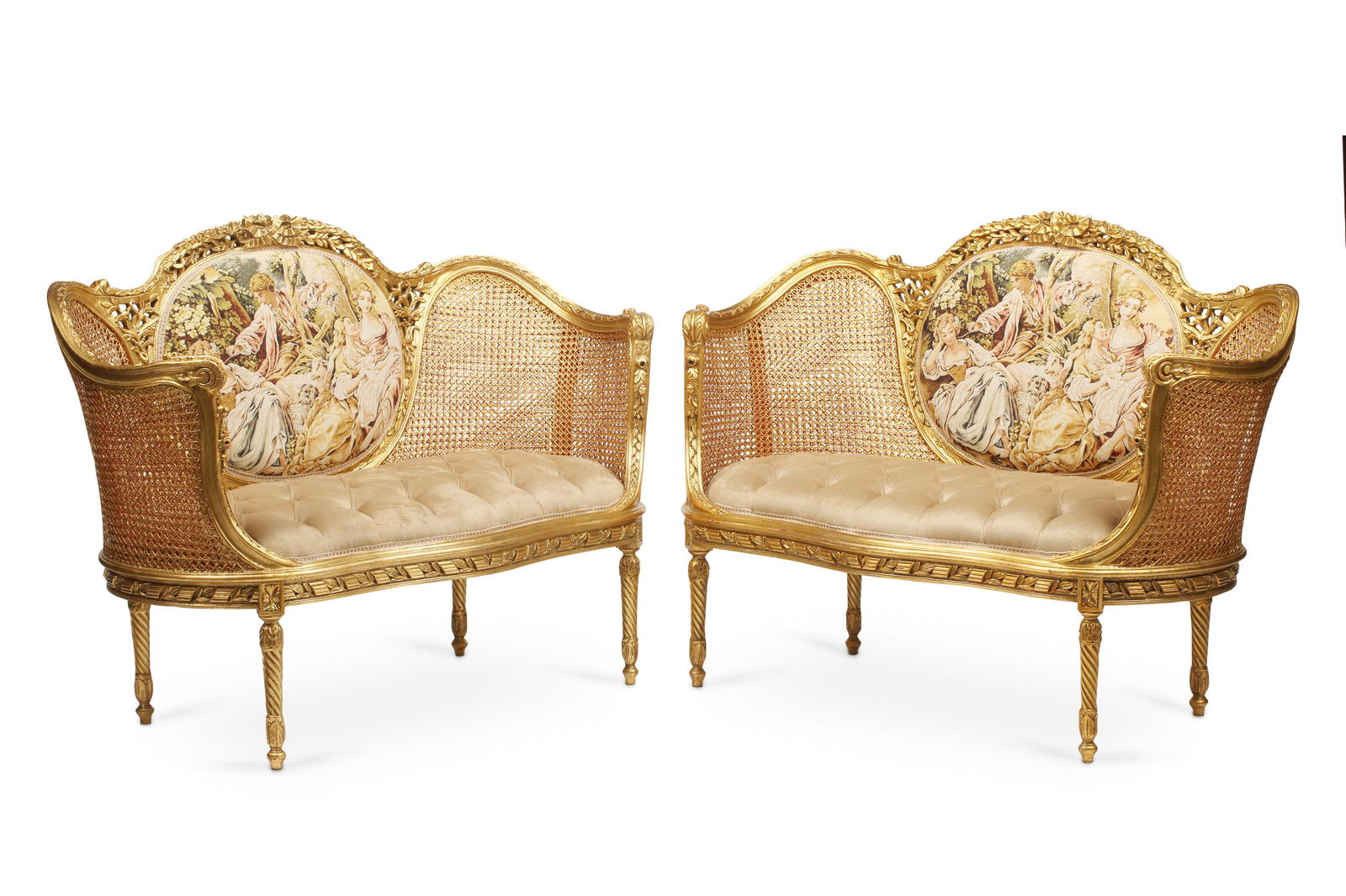 A pair of French caned settees: 20th century Each with a caned back and upholstered center panel, 2 pieces Each: 39" H x 53" L x 25" D