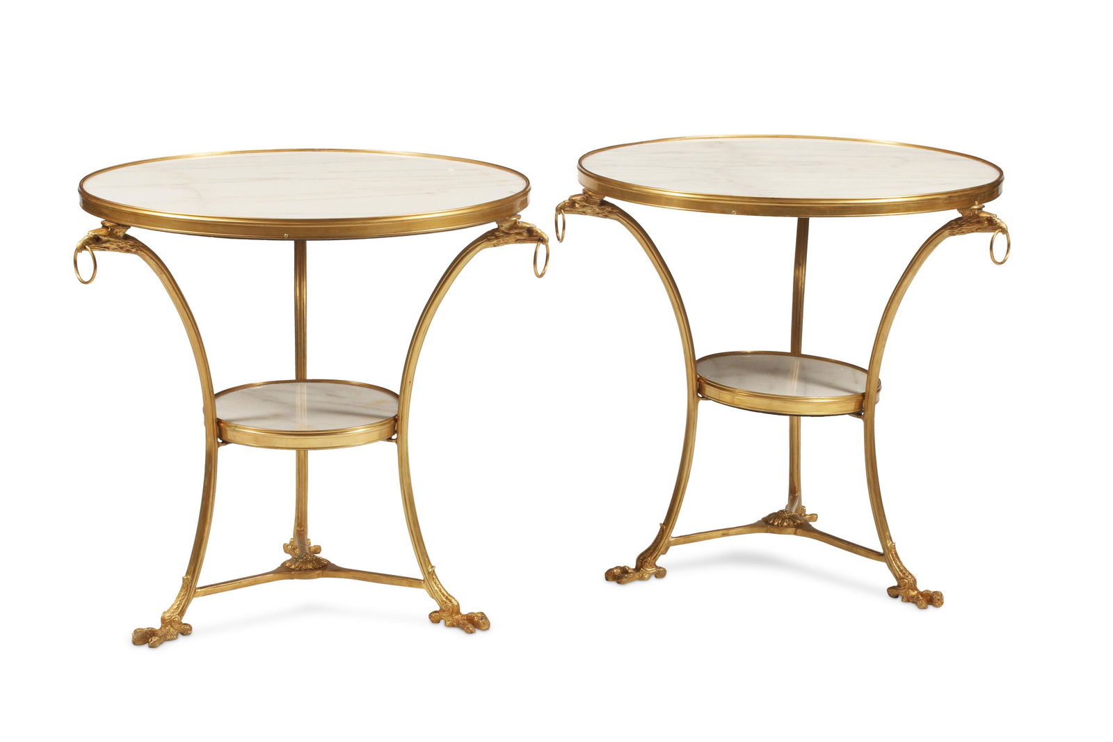 A pair of French Neoclassical-style gueridon tables: 20th century Each with gilt-bronze frame, two tiers, and white marble tops 29" H x 32" Dia.