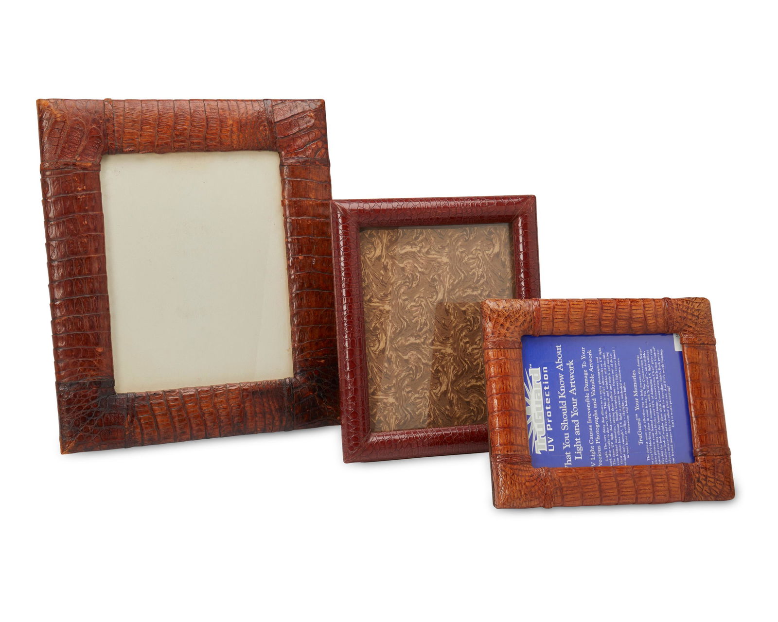 A group of three hide-wrapped frames (1 of 2)