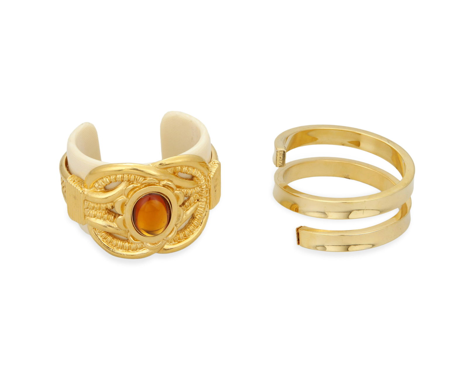 Two vintage Escada statement bracelets: Two vintage Escada statement braceletsCirca 1980sEach marked: Escada; one further marked: Made in ItalyComprising a French ivory Y2K wide cuff with gilt overlay band and large citrine colored central