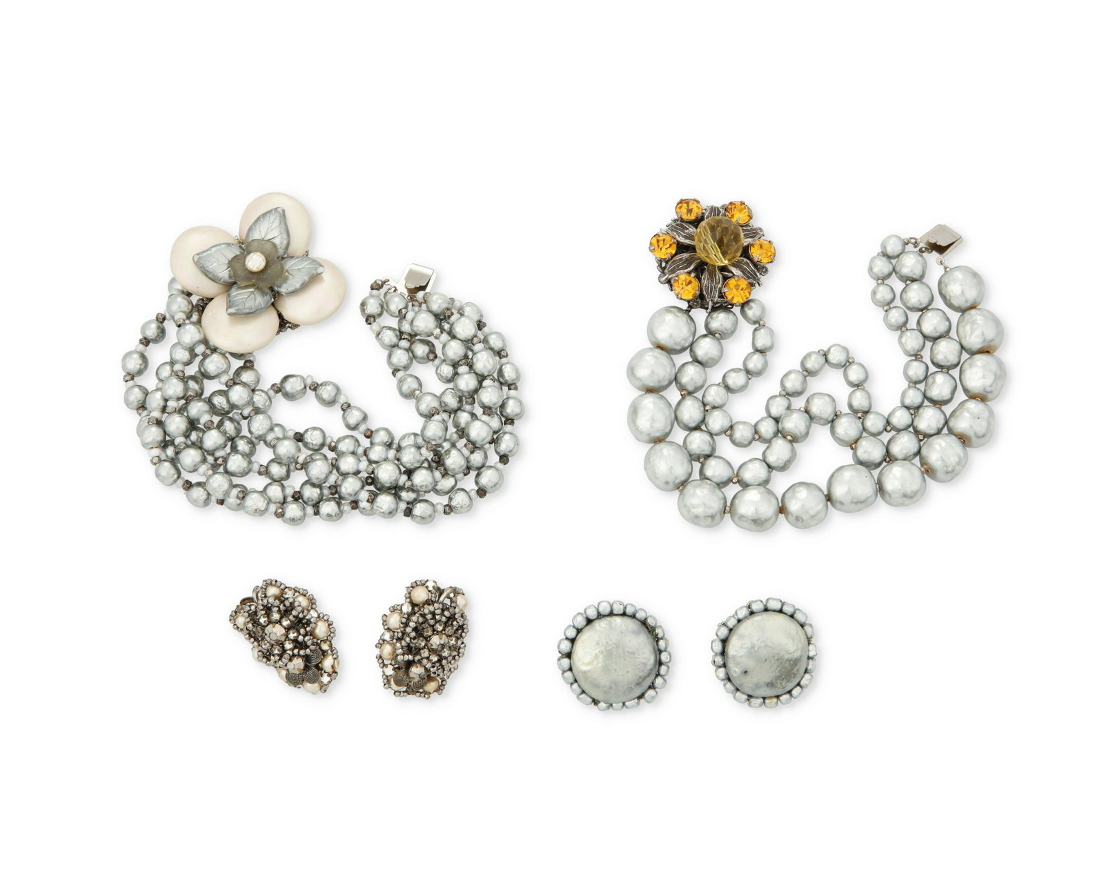 A group of Miriam Haskell jewelry: A group of Miriam Haskell jewelry Mid-20th century Each marked: Miriam Haskell Four works comprising a multistrand faux grey pearl bracelet with large floral clasp (7.5" L x 1.375" H), a gra