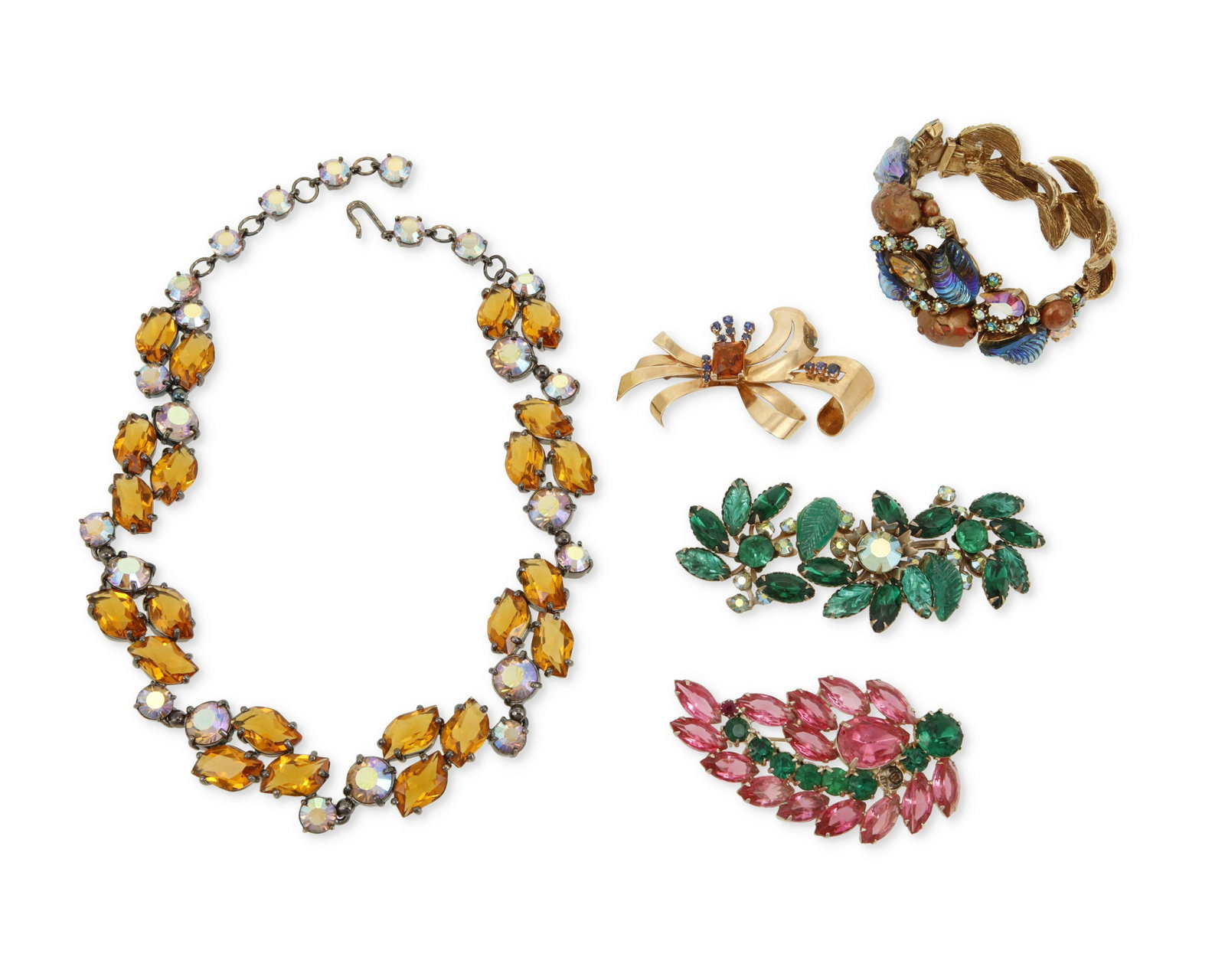 A group of costume jewelry: A group of costume jewelry Mid/late 20th century Two marked for designer Comprised of a HAR bracelet with multicolored stones and hinged terminals (6" inner C x 1.25" H), a caramel colored r