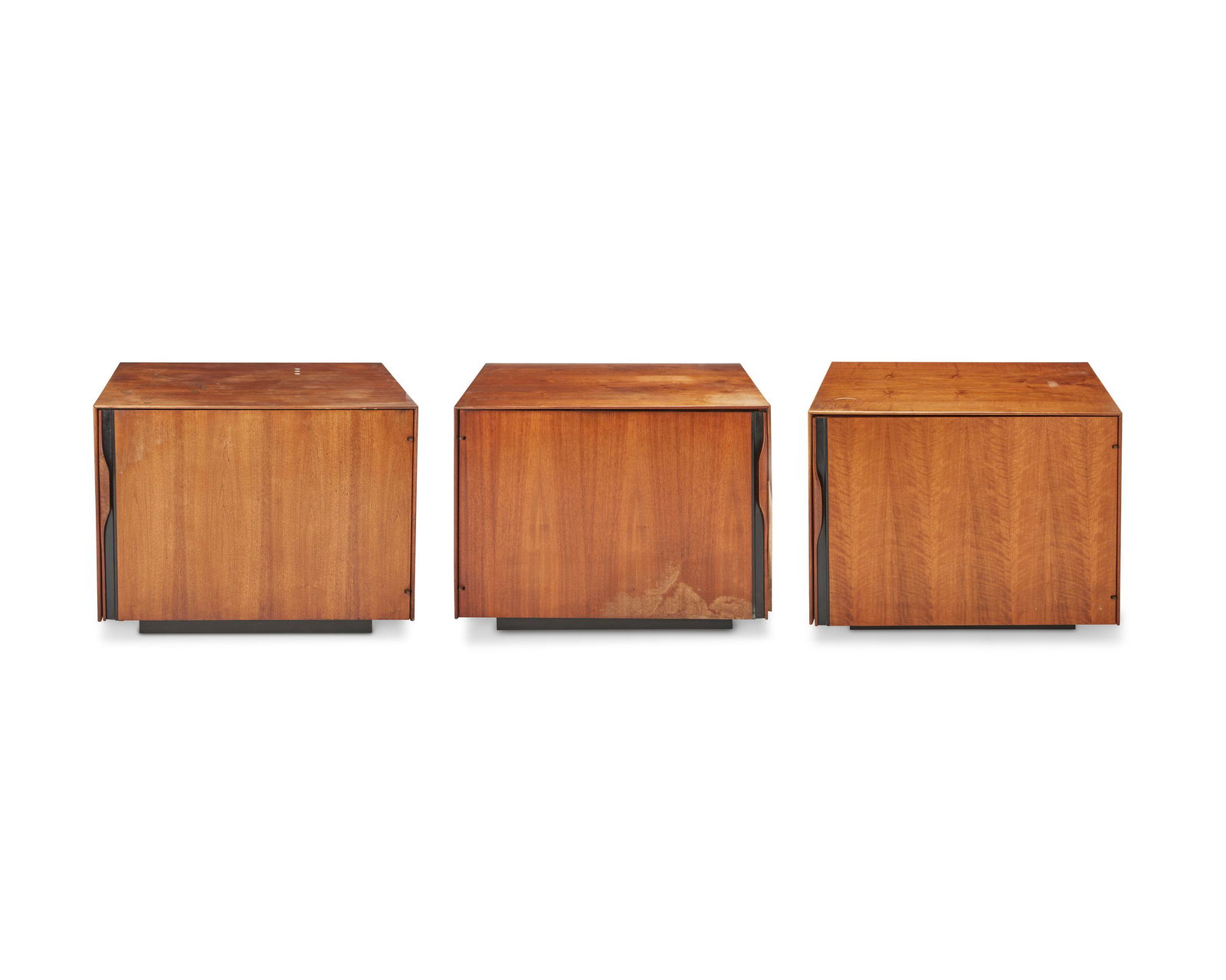 Three John Kapel for Glenn of California modern walnut bar cabinets Circa 1960s: Three John Kapel for Glenn of California modern walnut bar cabinetsCirca 1960sEach walnut cabinet with a sculpted handle revealing a fitted interior, one with a single shelf and one with a pull out su