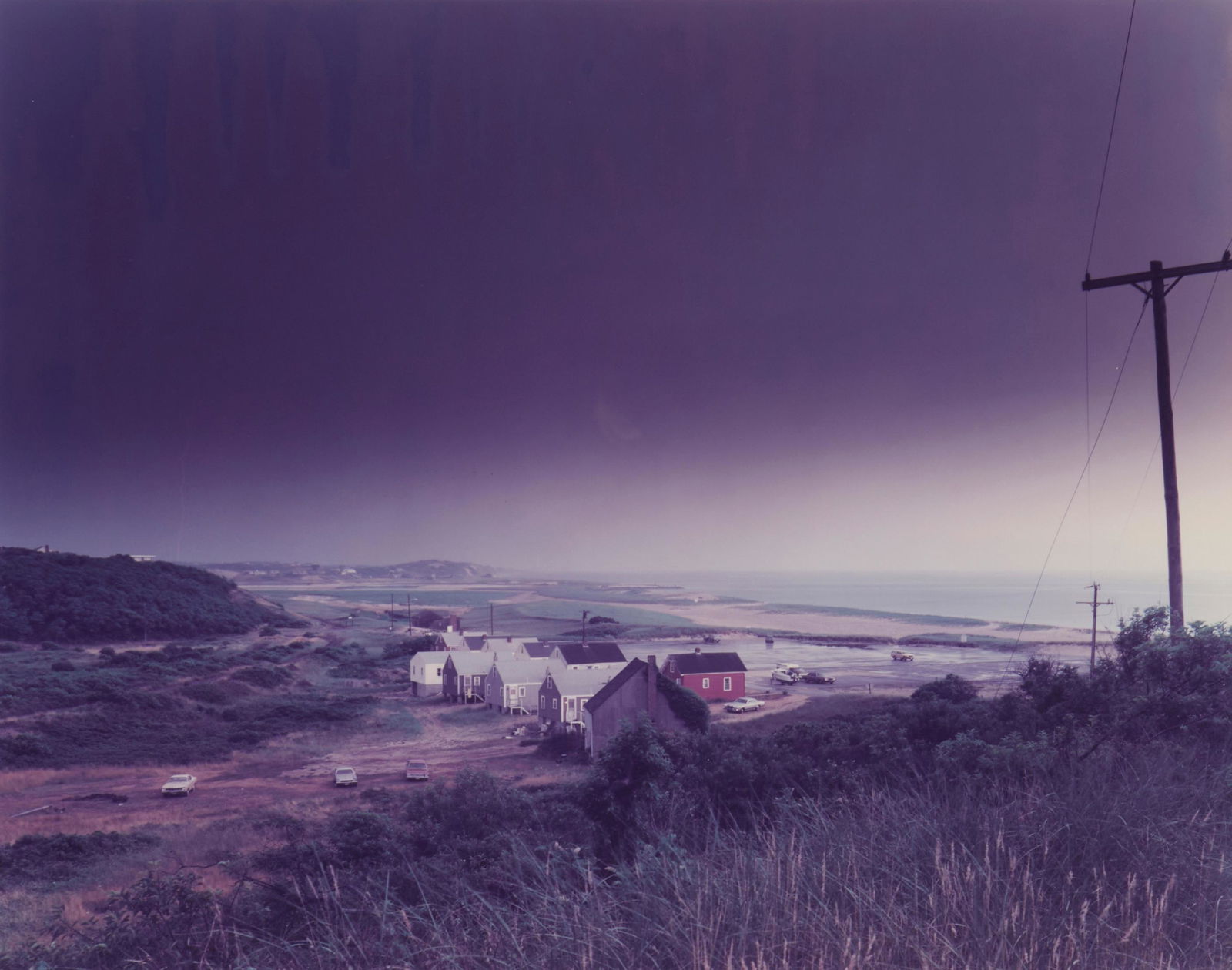 Joel Meyerowitz, (b. 1938), "Storm Over Corn Hill, Truro, Cape Cod," 1976, Photograph in colors on: Joel Meyerowitz(b. 1938)"Storm Over Corn Hill, Truro, Cape Cod," 1976Photograph in colors on paperFrom the edition of unknown size and dateAppears unsigned; titled and dated on a gallery lab