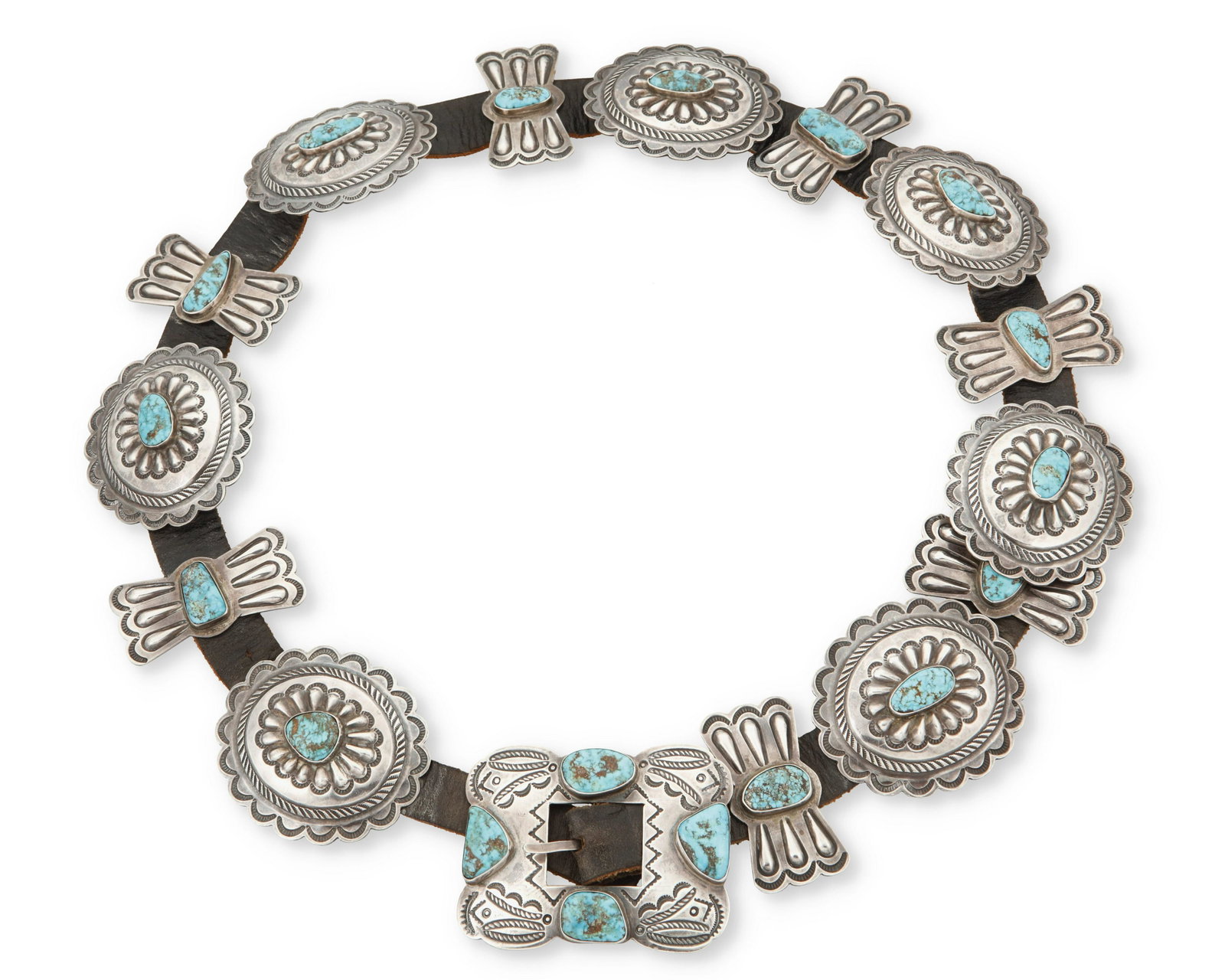 A Navajo concho belt: A Navajo concho belt Mid/late 20th century; Dine Appears unmarked Comprising seven silver oval conchos with set turquoise and seven silver butterfly conchos with set turquoise as well as a matching bu