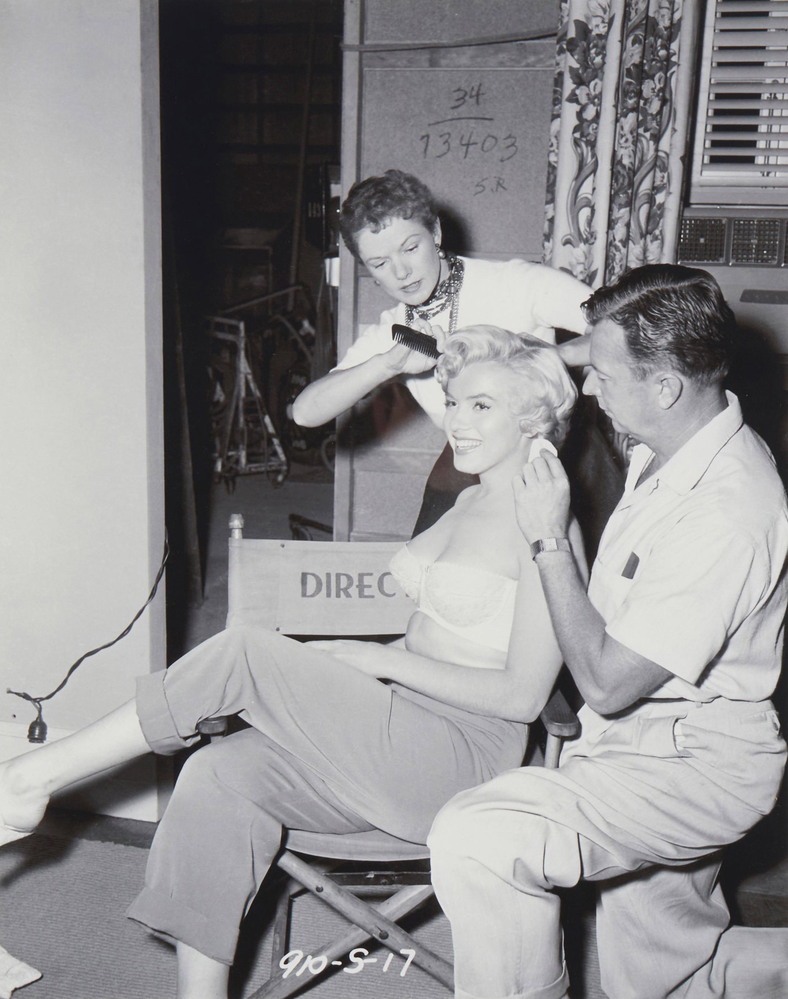 20th Century American School, Marilyn Monroe in hair and makeup, Photograph on paper, Sight: 13.75": 20th Century American School Marilyn Monroe in hair and makeup Photograph on paper From the edition of unknown size and date Appears unsigned; inscribed in the image in the lower edge, at center: 910-