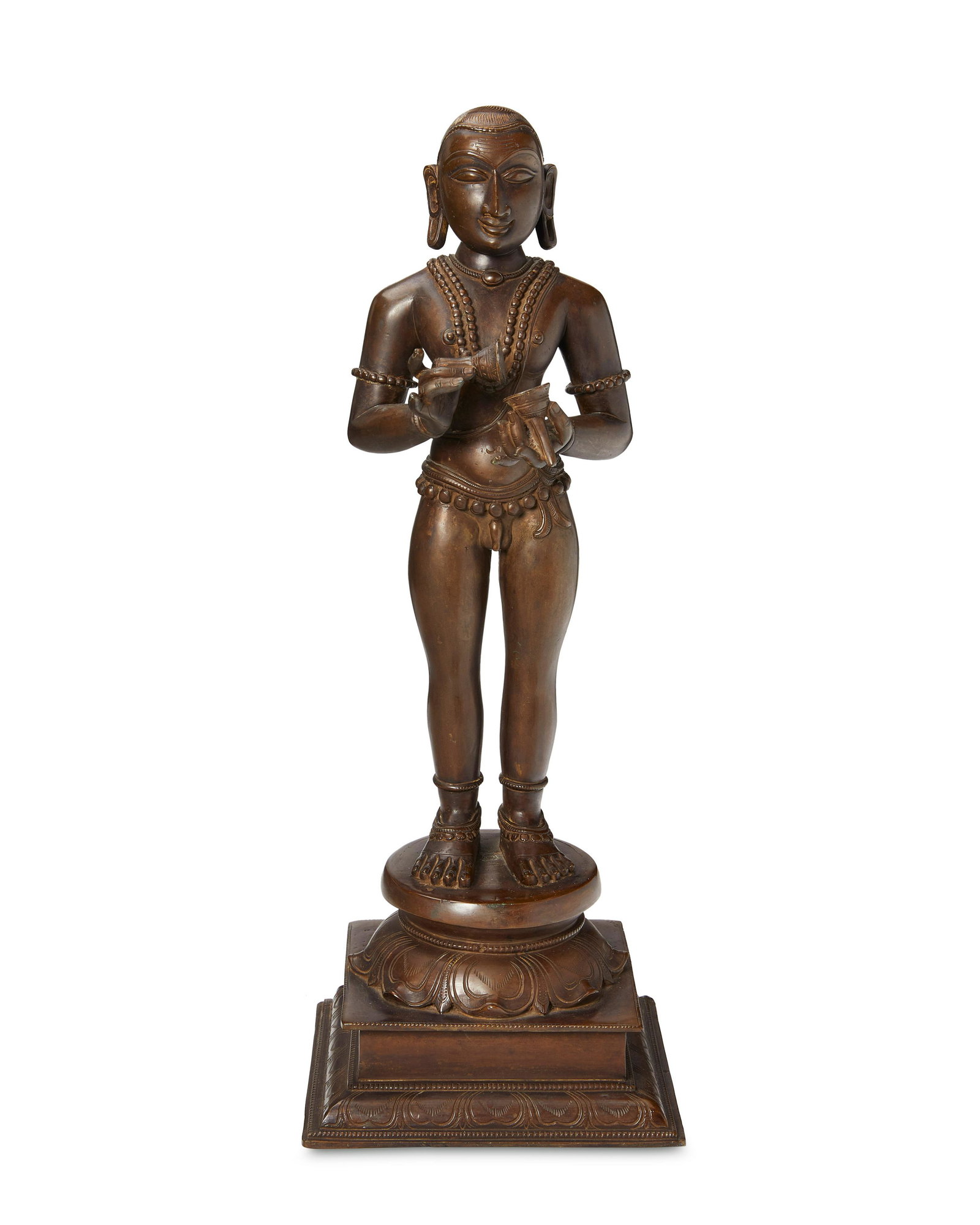 An Indian Chola-style Saint Sambandar bronze sculpture: An Indian Chola-style Saint Sambandar bronze sculpture 19th century or earlier; Swamimalai,Tamil Nadu, India Appears unmarked The lost-wax cast bronze sculpture likely depicting one of the Tamil Shaiv