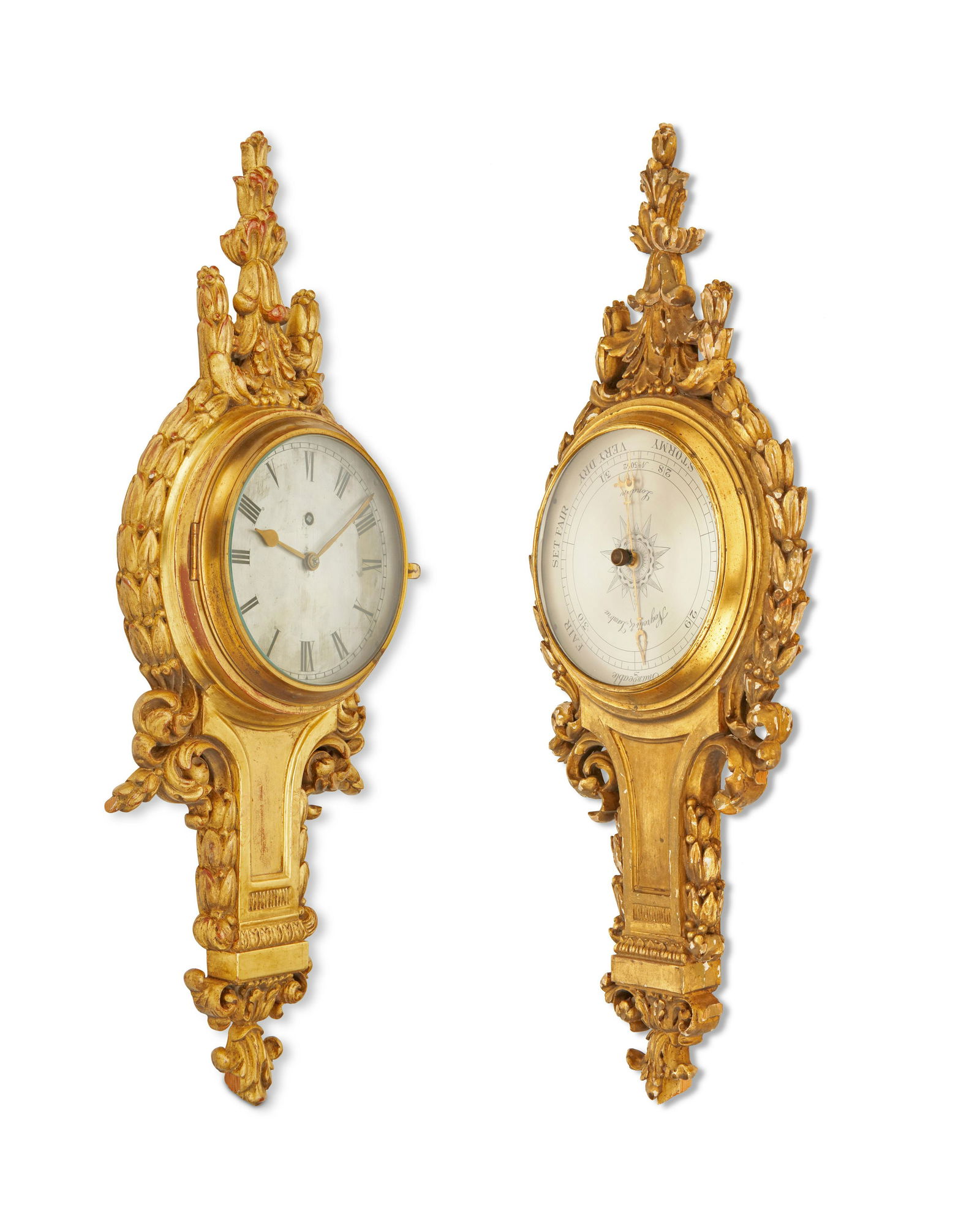 A near-pair French wall clock and barometer set: A near-pair French wall clock and barometer setLate 19th/early 20th centuryEach carved giltwood with silvered metal dials and black numerals, 2 piecesLarger: 28" H x 10" W x 3.5" D