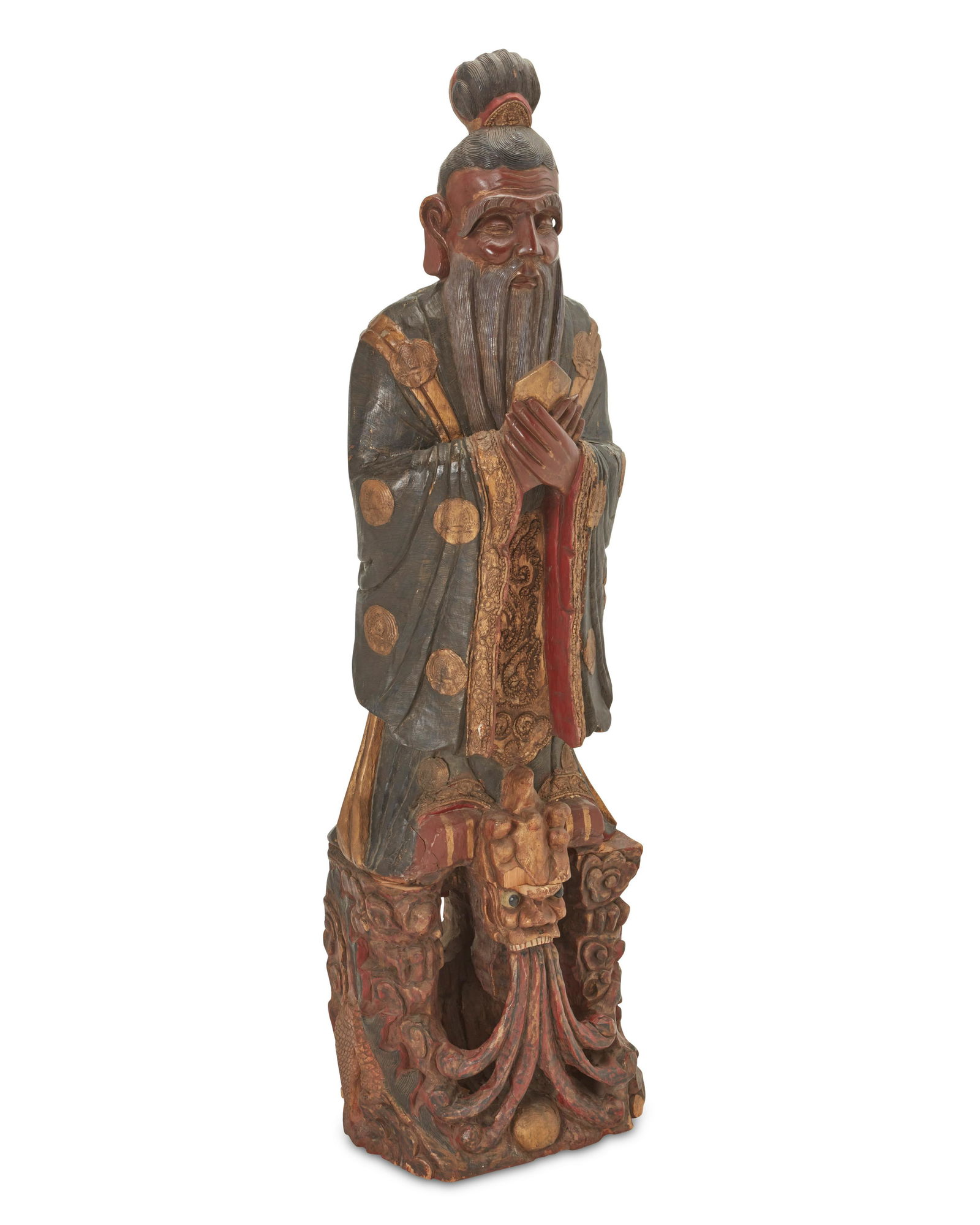 A Chinese polychromed wood sculpture of a scholar: A Chinese polychromed wood sculpture of a scholarEarly 20th centuryThe carved and polychromed wood sculpture depicting a standing figure in robes, likely Confucius70" H x 19.5" W x 13.5"