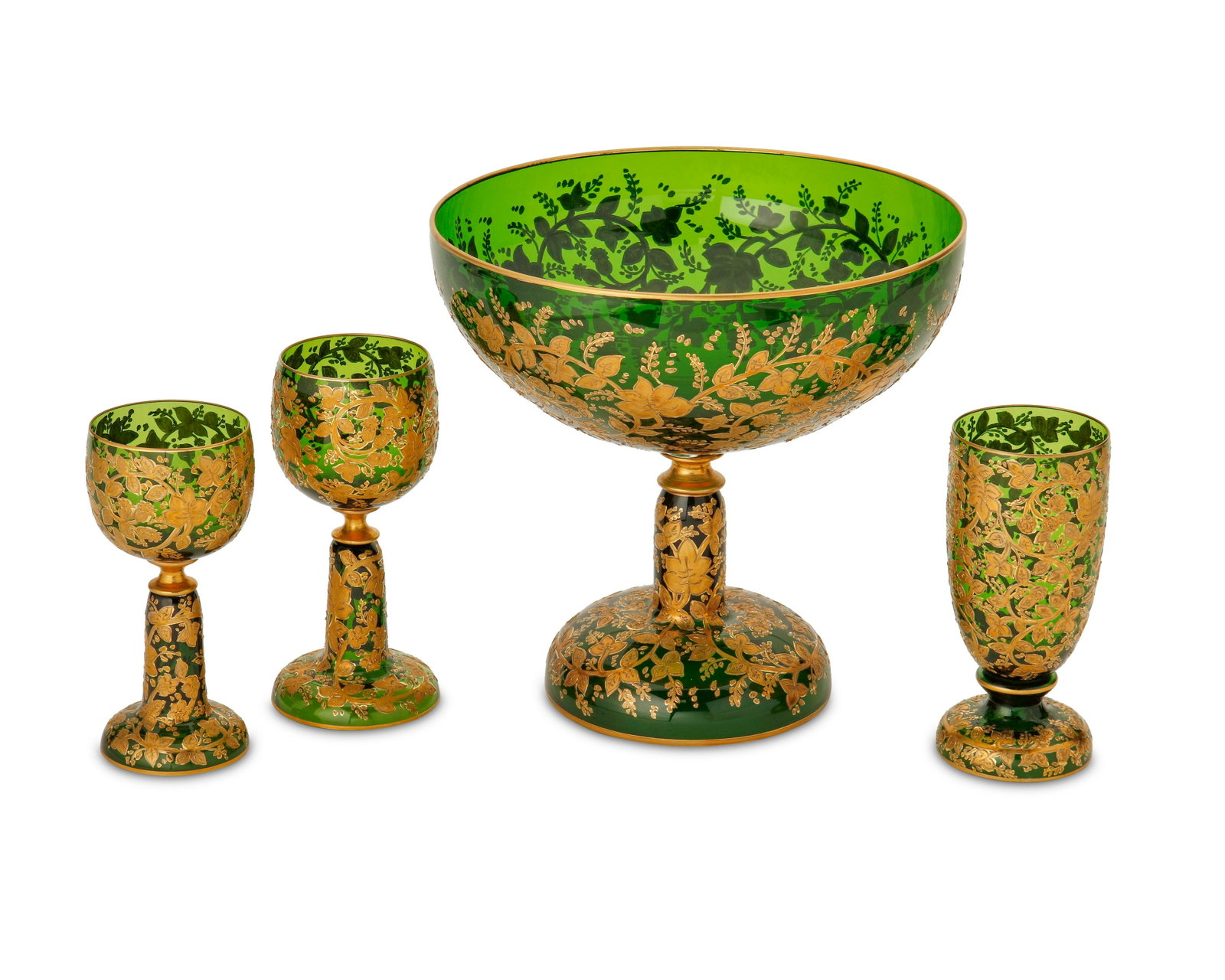 A group of Murano Cenedese glassware: A group of Murano Cenedese glassware 20th century The bowl with Murano Cenedese Vetri label to underside Each forest green translucent glass with gilt enamel foliate and floral vines, comprising 1 foo