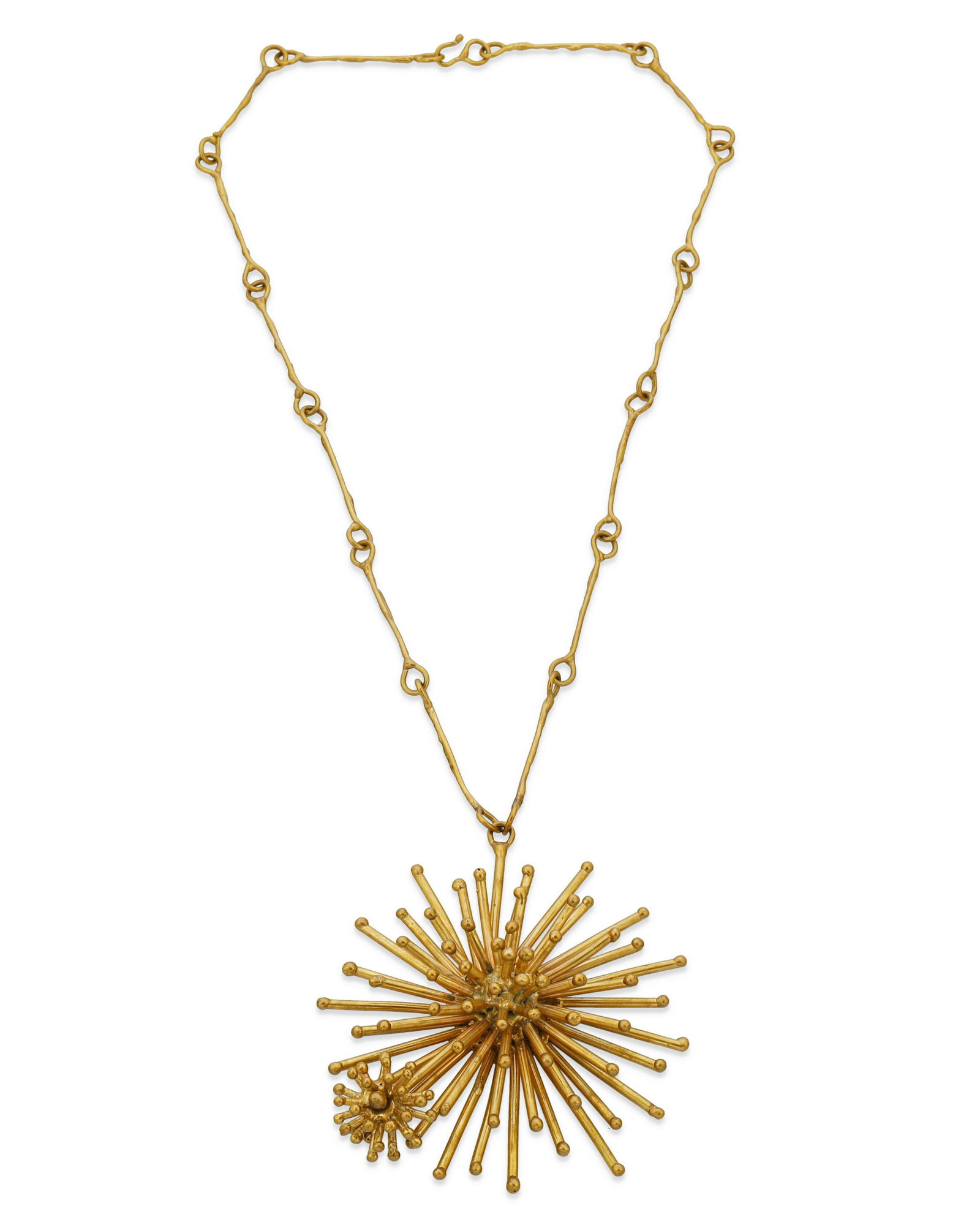 A Pal Kepenyes brass starburst necklace: A Pal Kepenyes brass starburst necklaceCirca 1970sPartially stamped: Pal KepenyesA Modernist-style necklace designed with a large brass starburst pendant with an attached rotating companion star, susp