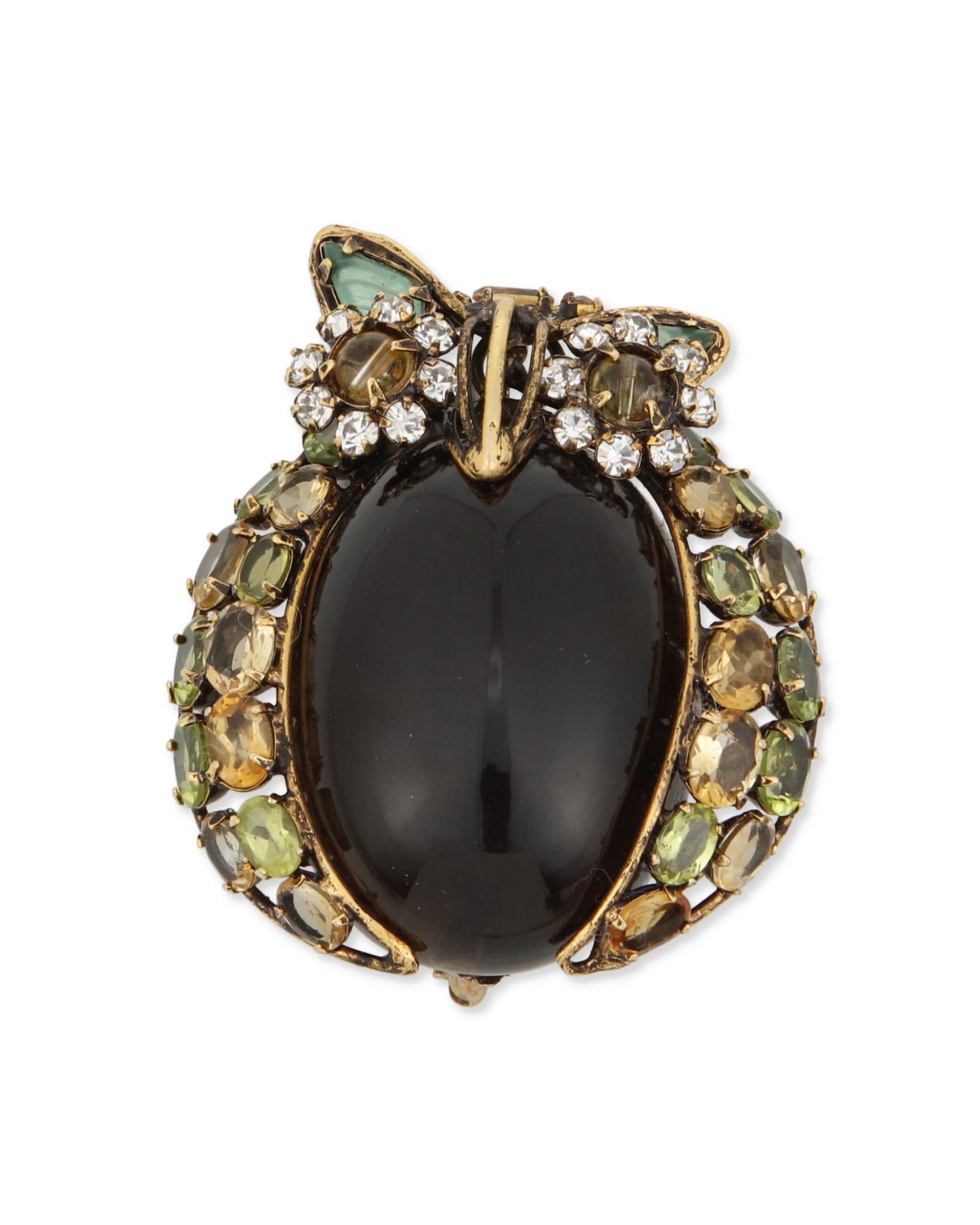 A C&D owl brooch: A C&D owl broochLate 20th/21st centuryStamped: C&D JewelryA brass owl brooch centering a large cabochon smoky quartz and further set with citrine, peridot, synthetic emerald and white crystals2.25&quo