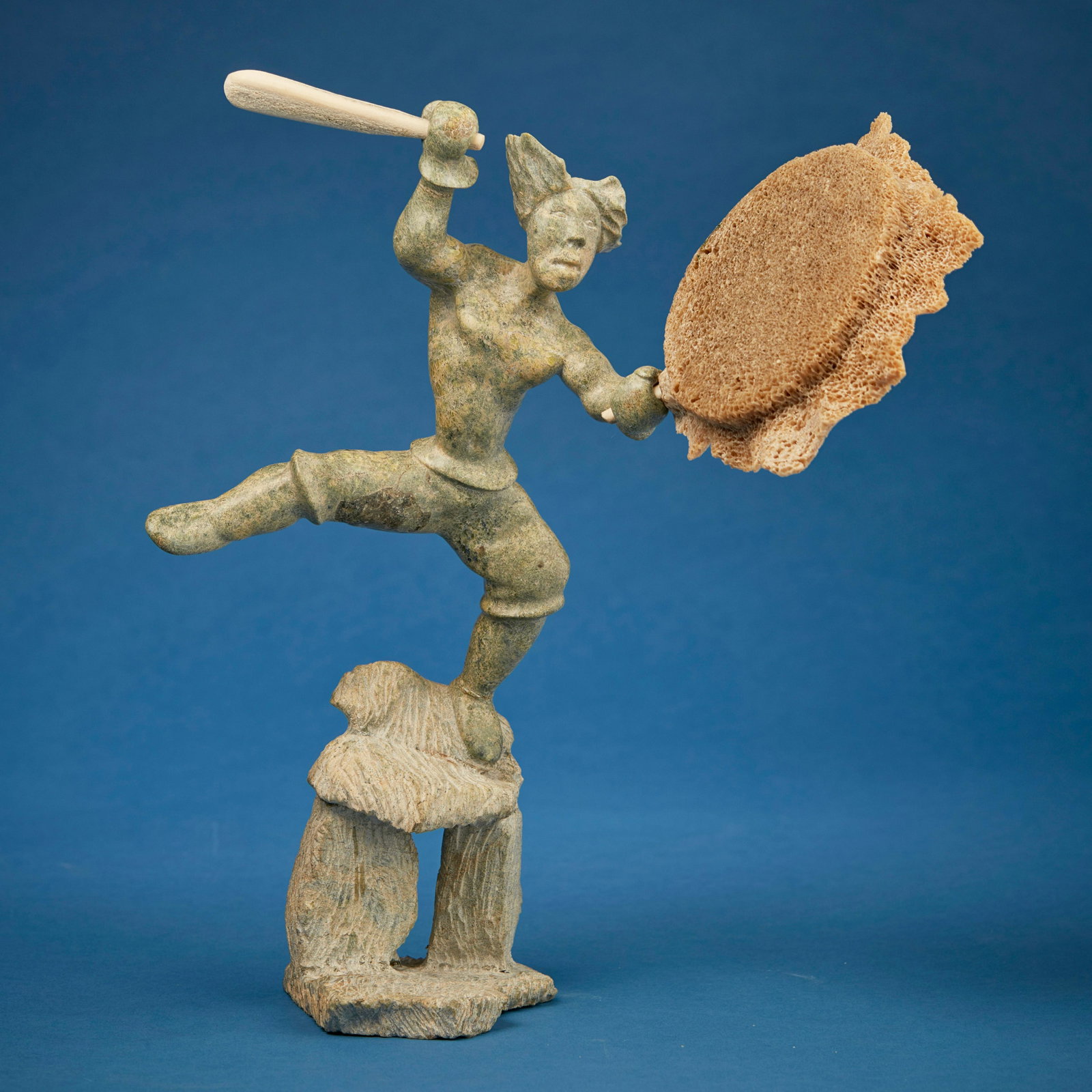 Davie Atchealak (1947-2006, Inuit; Frobisher Bay/Iqaluit), Carved figure with drum and drumstick: Davie Atchealak (1947-2006, Inuit; Frobisher Bay/Iqaluit) Carved figure with drum and drumstick Stone, bone, and sea sponge Signed to underside: Davie Atchealak / (C) 15" H x 14.5" W x 6" D Provenance