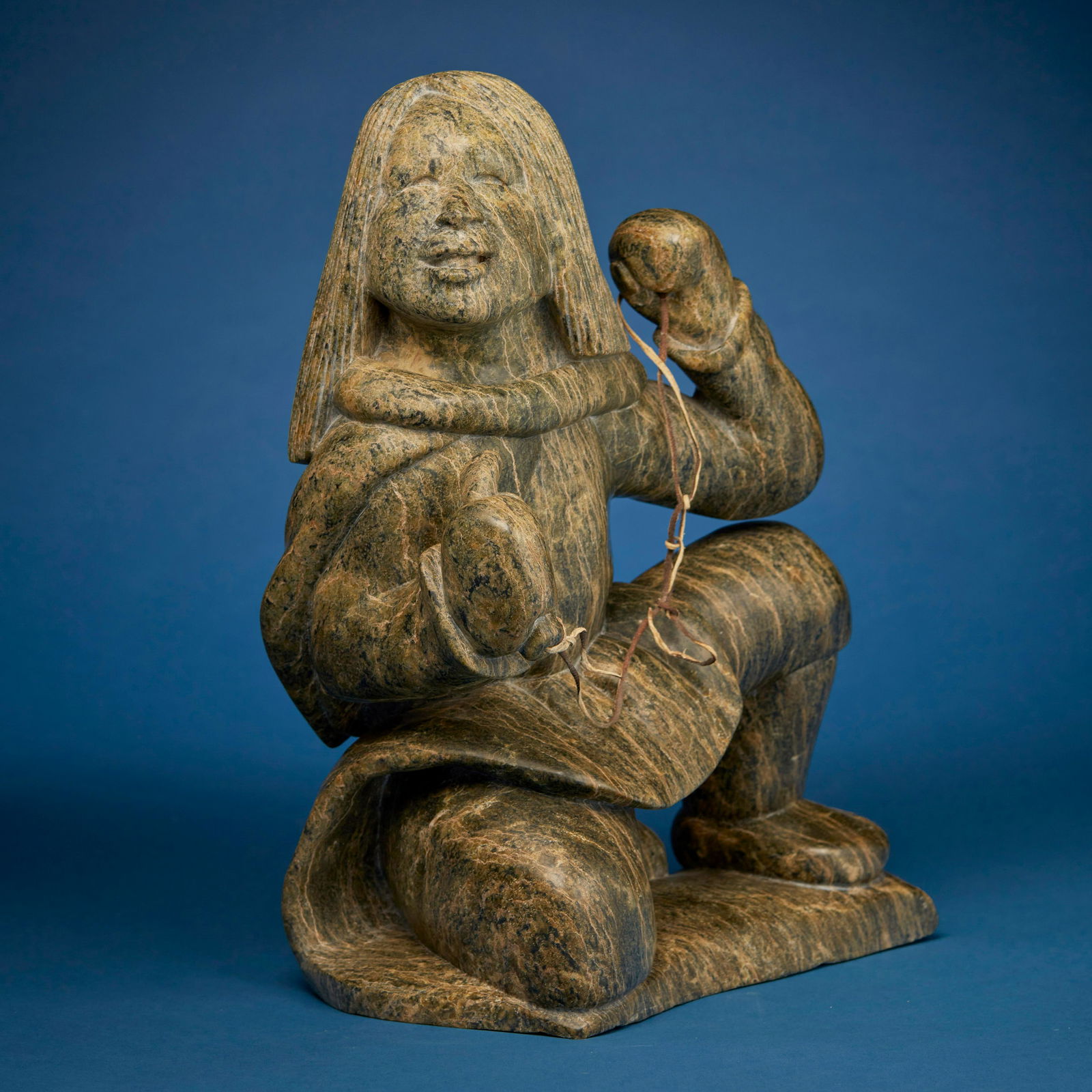Kiawak Ashoona (1933-2014, Inuit; Cape Dorset/Kinngait), Carved kneeling figure with lanyard, circa (1 of 5)