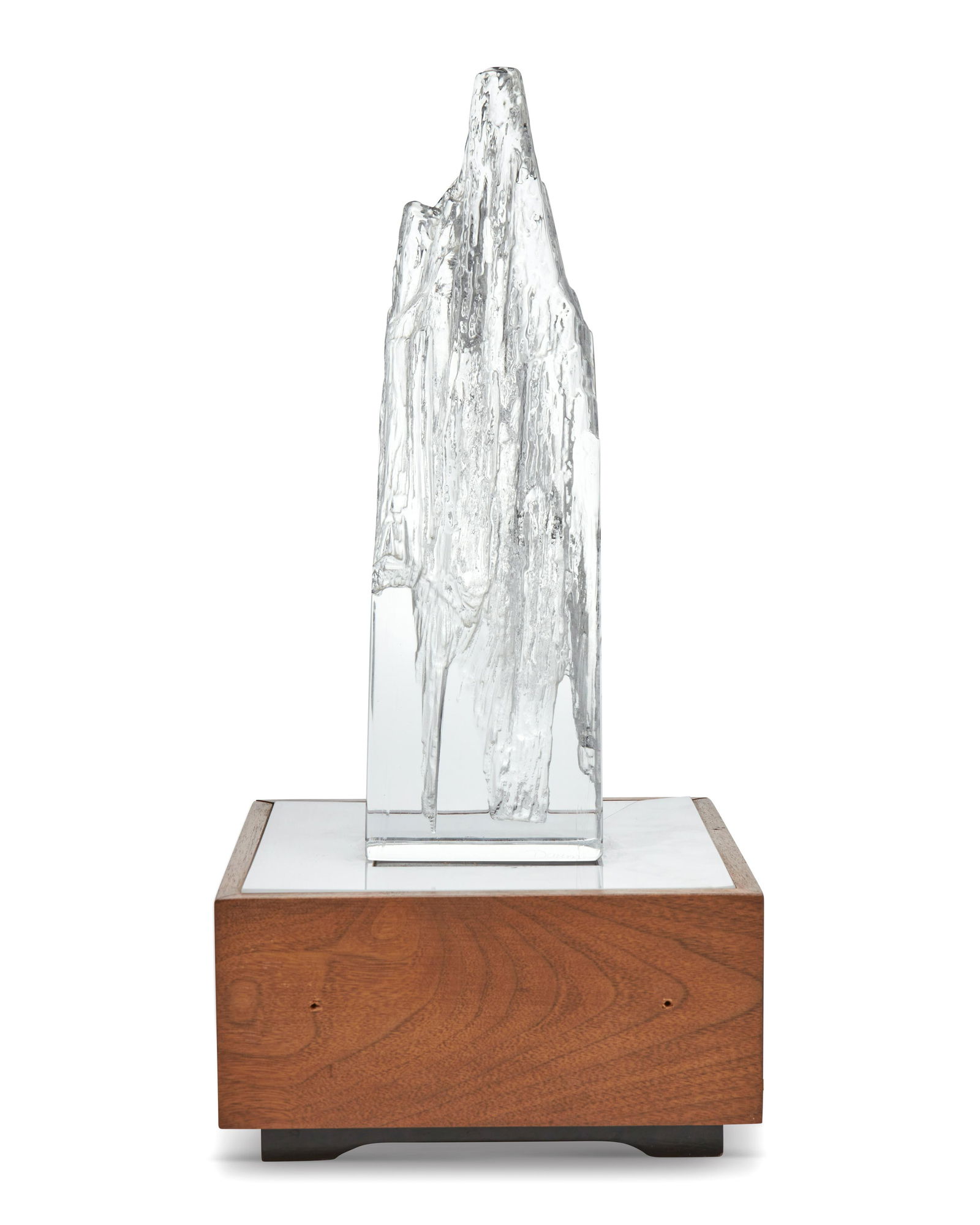 A Daum crystal iceberg sculpture with lighted base: A Daum crystal iceberg sculpture with lighted baseCirca 1970s; Nancy, FranceCrystal signed to the lower edge: DaumThe molded crystal sculpture, likely an abstracted iceberg form, with later added illu