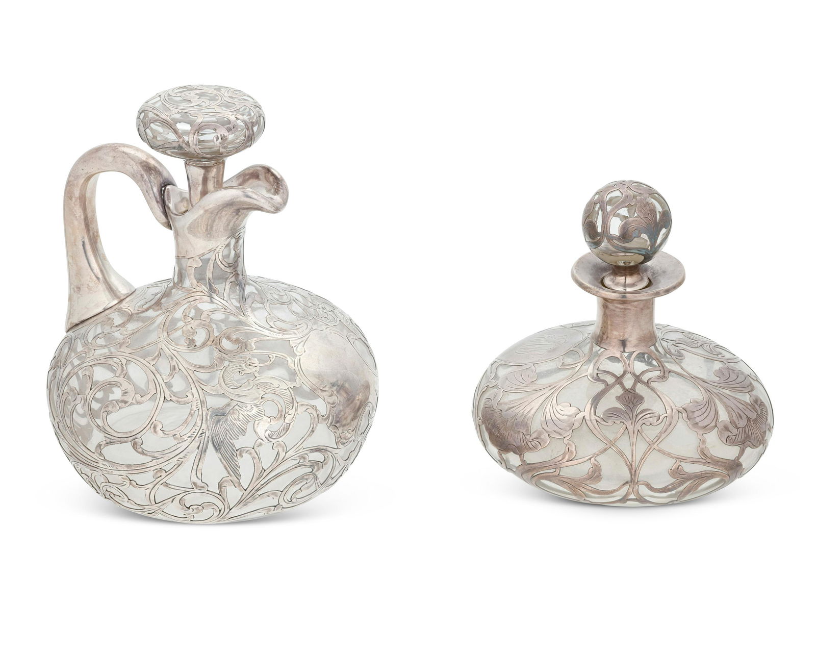 A pair of silver overlay jugs (1 of 2)
