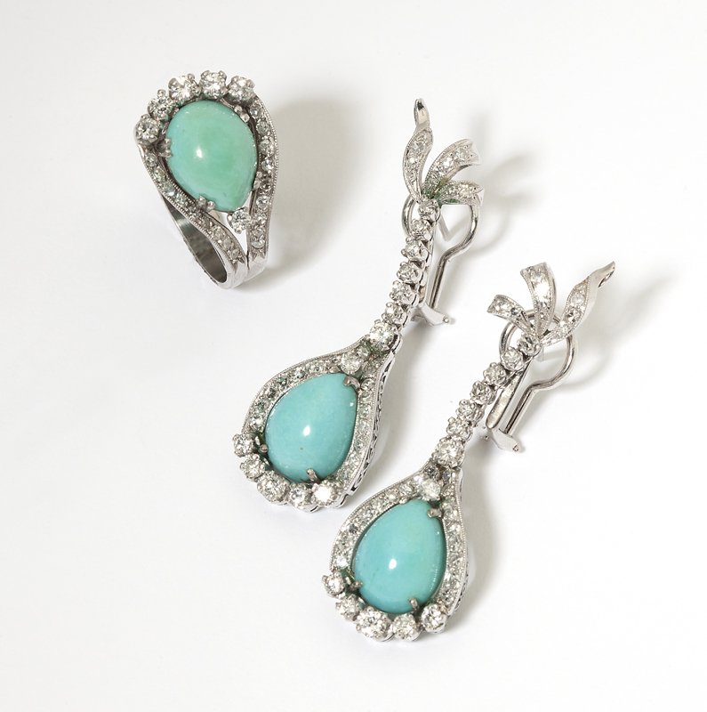 A set of turquoise, diamond and white gold jewelr: Each 18K gold, comprising: a ring and a pair of ear pendants (2''); the set enhanced with 3 cabochon turquoise and 132 single and full-cut round diamonds totaling approximately 2.60 cts, and graded H-