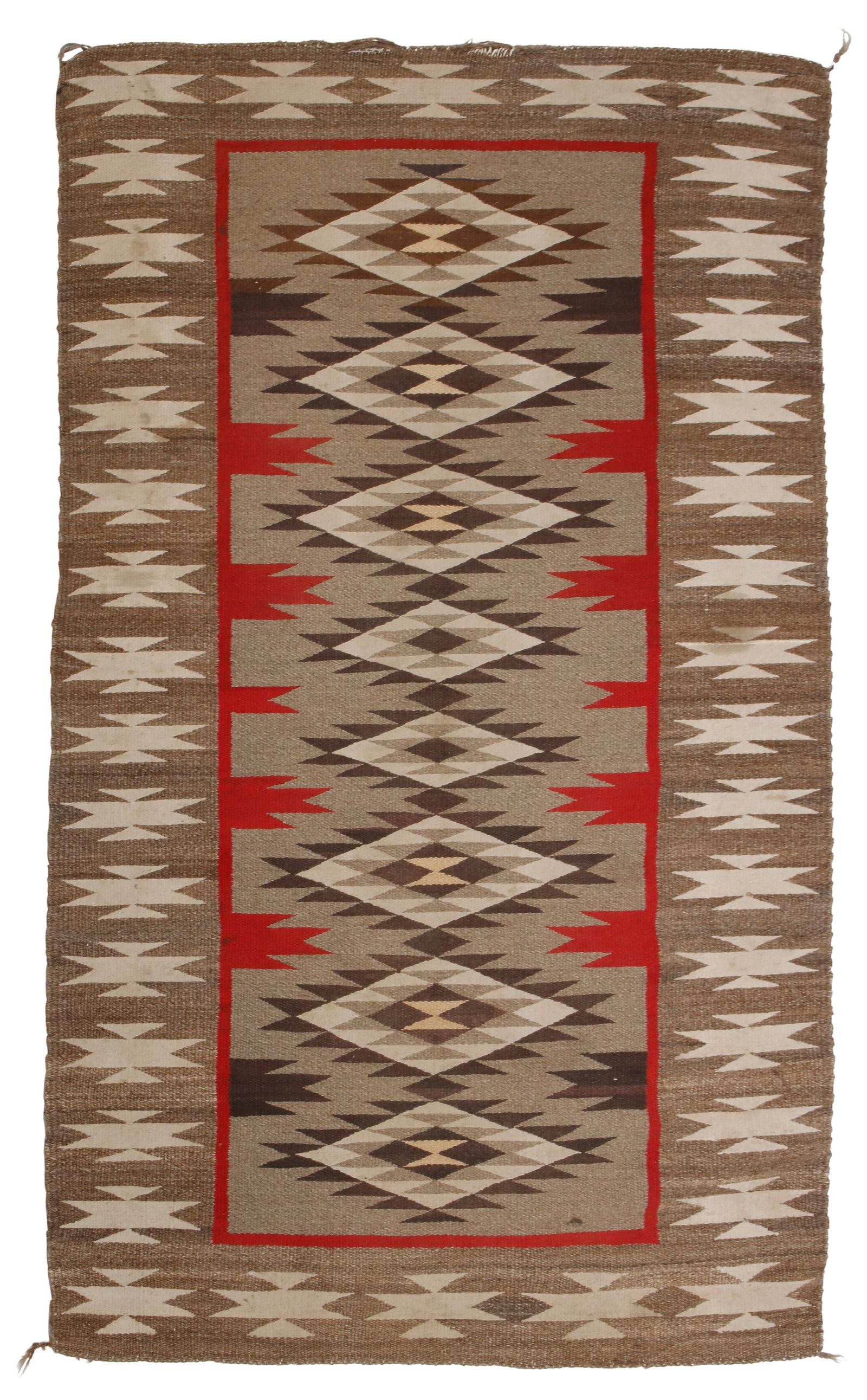 A Navajo regional rug: A Navajo regional rug Mid-20th century, DinE Woven in grey, cream, red, and brown wool with a central column of sawtooth diamonds 62" H x 36" W
