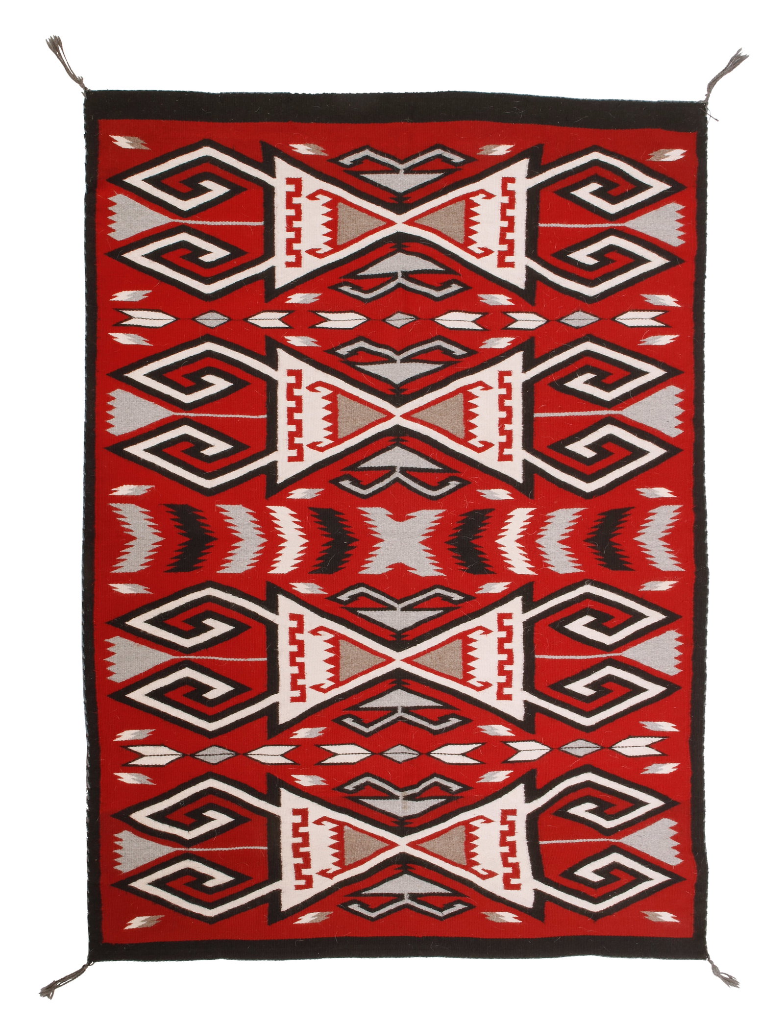 A Navajo Ganado rug: A Navajo Ganado rug Late 20th century, DinE Woven in red, cream, black, and grey wool with four central stacked hooked motifs 71" H x 53" W Provenance: Private Collection, Southern Californi