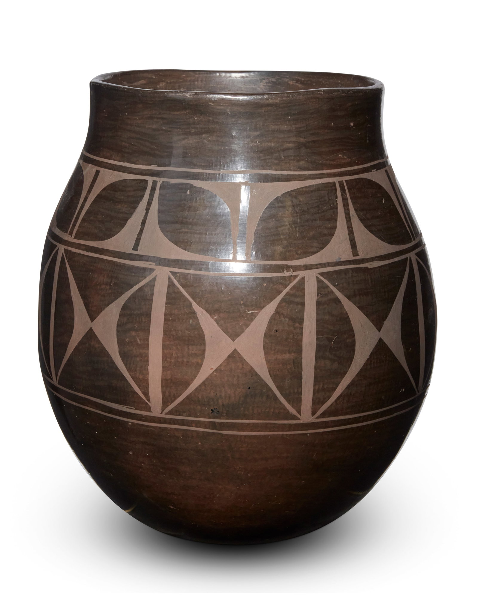 Rafaelita Aguilar (b. 1937, Kewa/Santo Domingo Pueblo): Rafaelita Aguilar (b. 1937, Kewa/Santo Domingo Pueblo) A Santo Domingo blackware pottery jar Signed: Rafaelita Aguilar / Santo Domingo Pueblo A large storage jar with two rows of geometric banding 13&