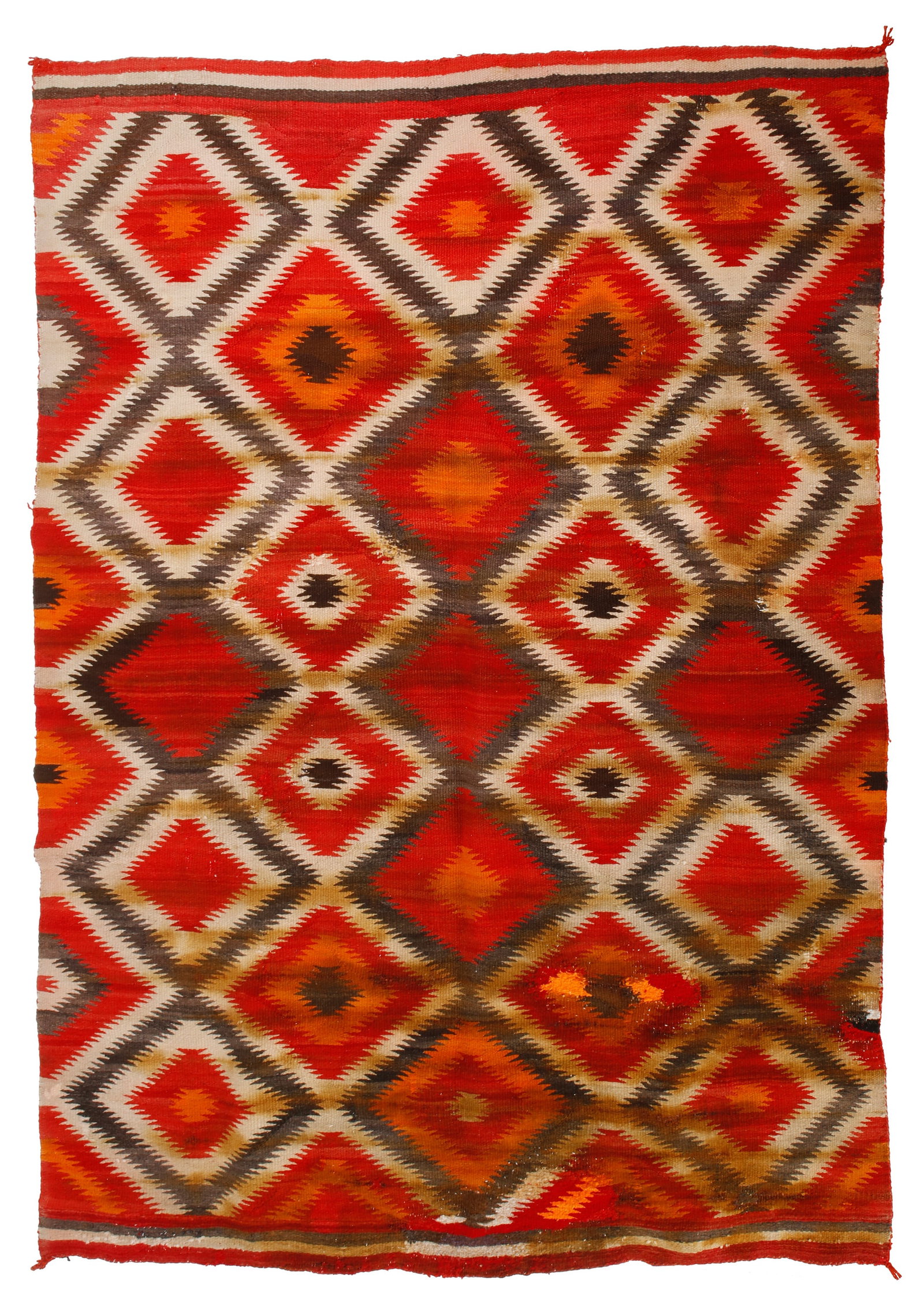 A Navajo Transitional eyedazzler blanket: A Navajo Transitional eyedazzler blanket Early 20th century, DinE Woven in red, purple, orange, and cream wool with multiple conjoined sawtoooth diamonds in an all-over eyedazzler pattern 94" H x