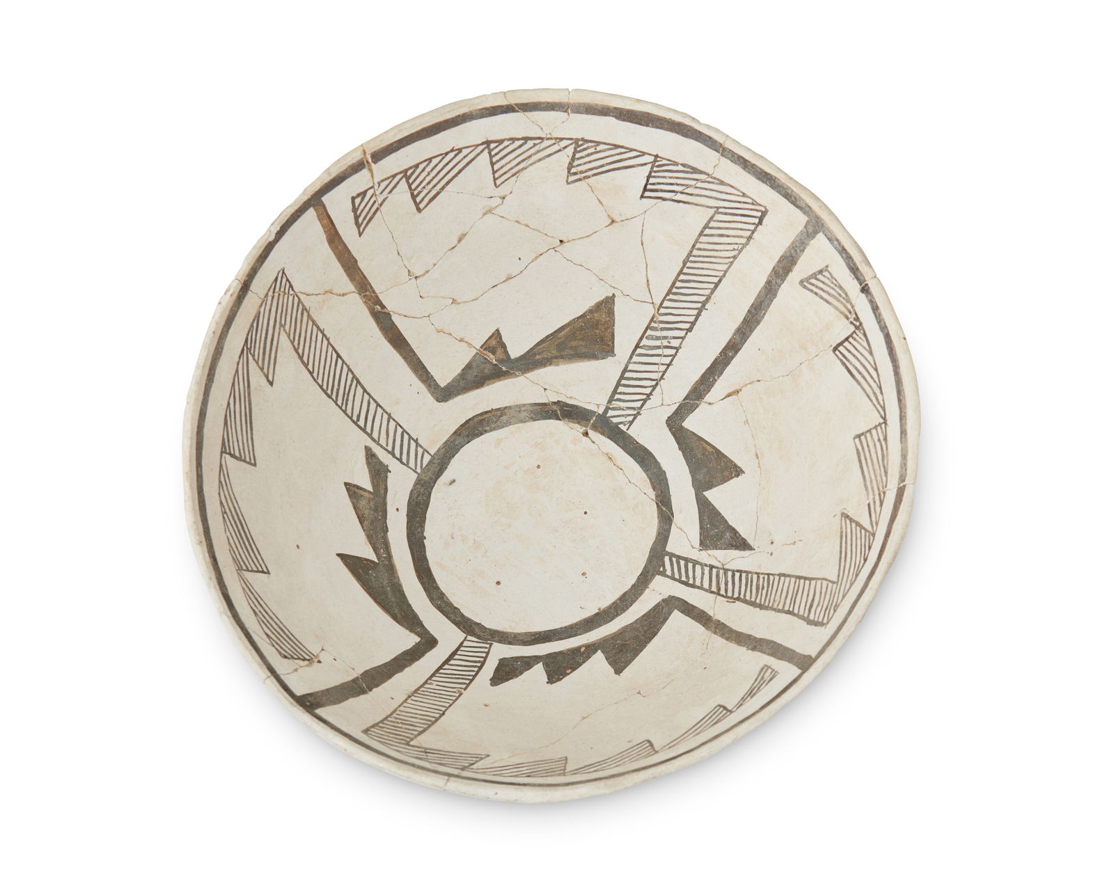 A Chaco black-on-white pottery bowl: A Chaco black-on-white pottery bowlPre-1500 ADWith a geometric stepped motif to the interior rendered in black slip on a white ground5.5" H x 10.75" Dia. Provenance: Private Collection, Sout