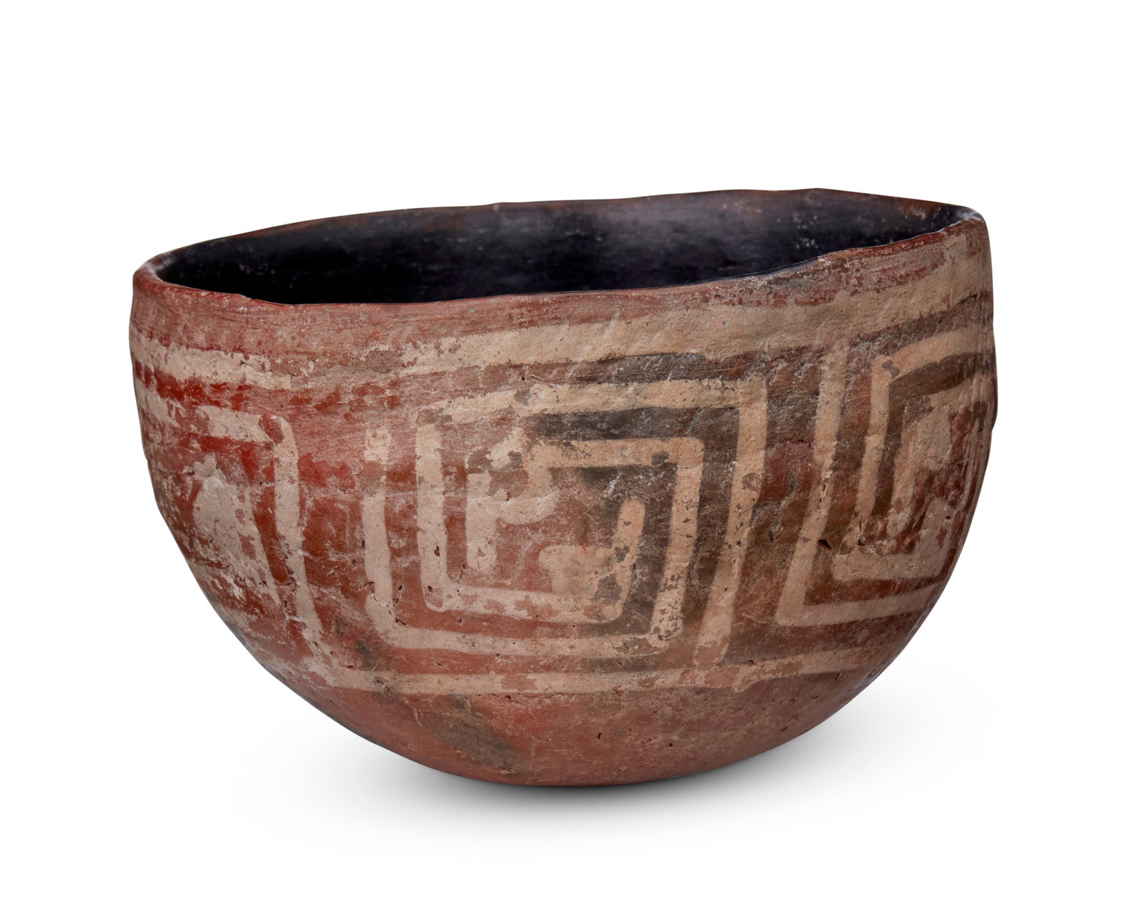 A Salado polychrome pottery bowl: A Salado polychrome pottery bowl Pre-1500 AD; Southwestern United States A small intact corrugated pottery bowl with buff geometric banding and a smudged and polished black interior 2.75" H x 4.5