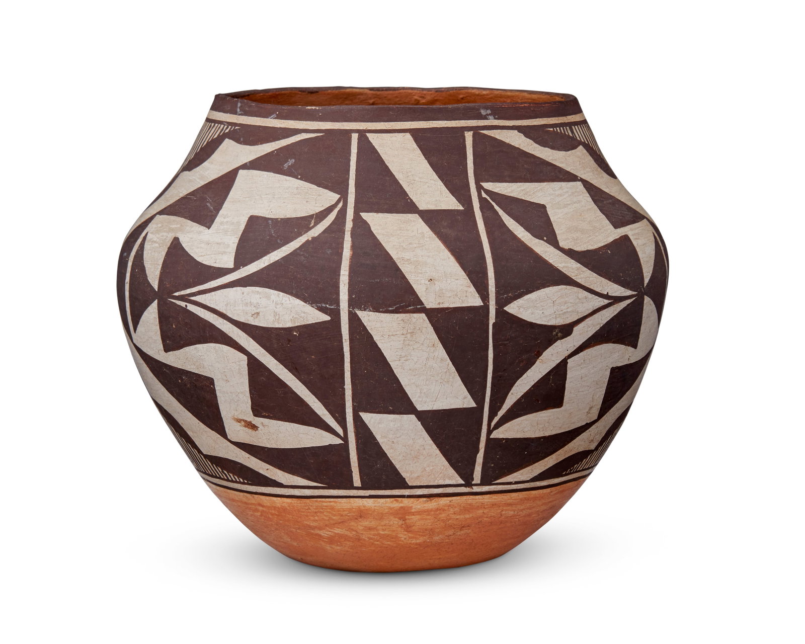 An Acoma Pueblo pottery vessel: An Acoma Pueblo pottery vessel Mid-20th century Appears unsigned A polychrome jar with geometric and rain motifs, with a red base with slight indentation 6.5" H x 7.75" Dia. Provenance: Andr