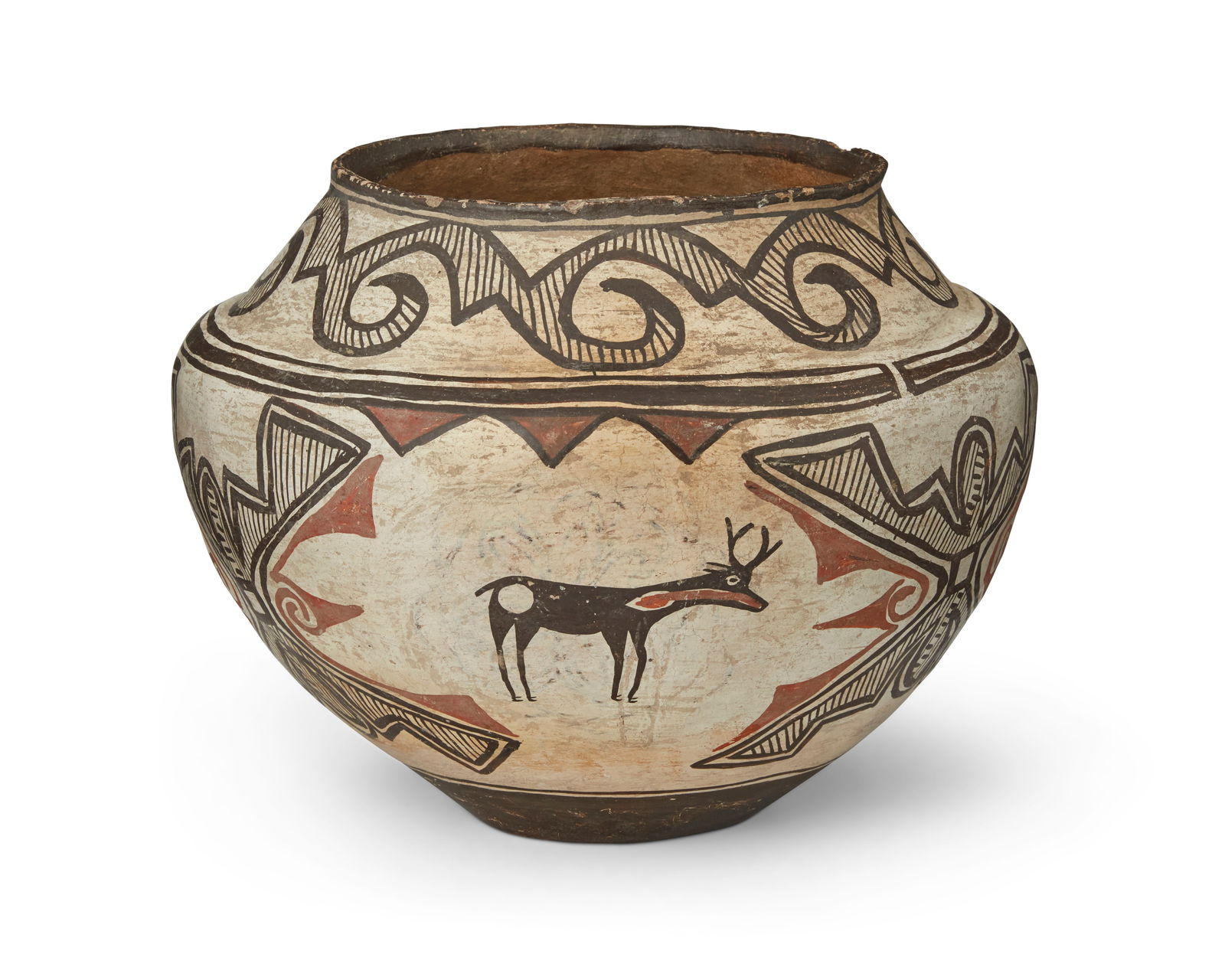 A Zuni Pueblo polychrome pottery olla: A Zuni Pueblo polychrome pottery ollaEarly 20th century, New MexicoA large olla with heartline deer motifs and curvilinear and geometric banding, and an indented base10" H x 13i Dia.