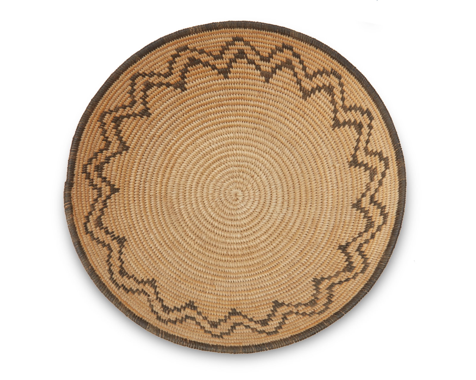 A Chemehuevi basket: A Chemehuevi basket Late 19th/early 20th century; Great Basin/Southwest United States A coiled shallow bowl with zigzag banding to sides 3.25" H x 10.5" Dia.