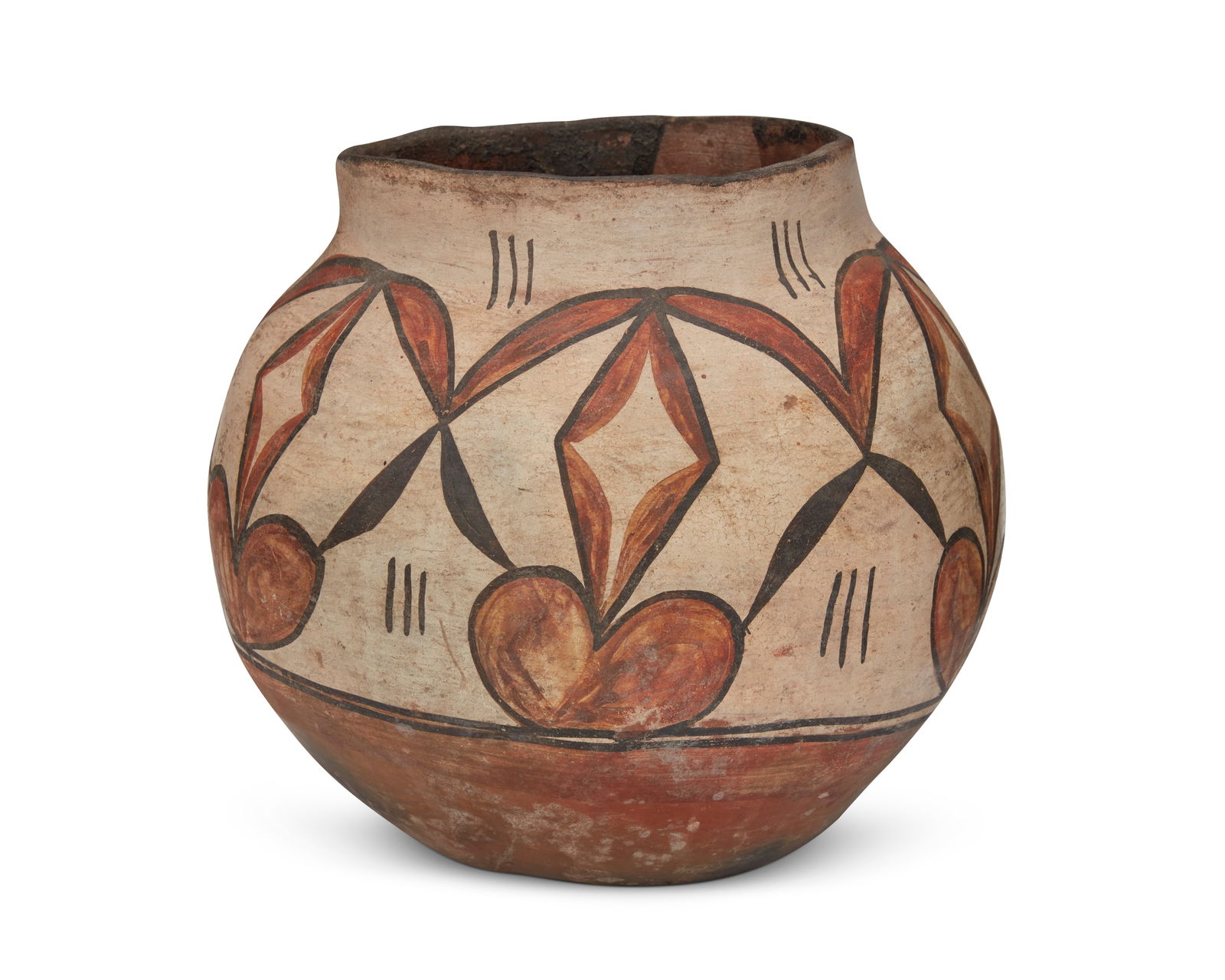A Zia Pueblo polychrome pottery olla: A Zia Pueblo polychrome pottery ollaLate 19th/early 20th century, New MexicoUnmarkedThe three-color jar with black and red on white foliate motifs and an indented base8" H x 9.5" Dia. Proven