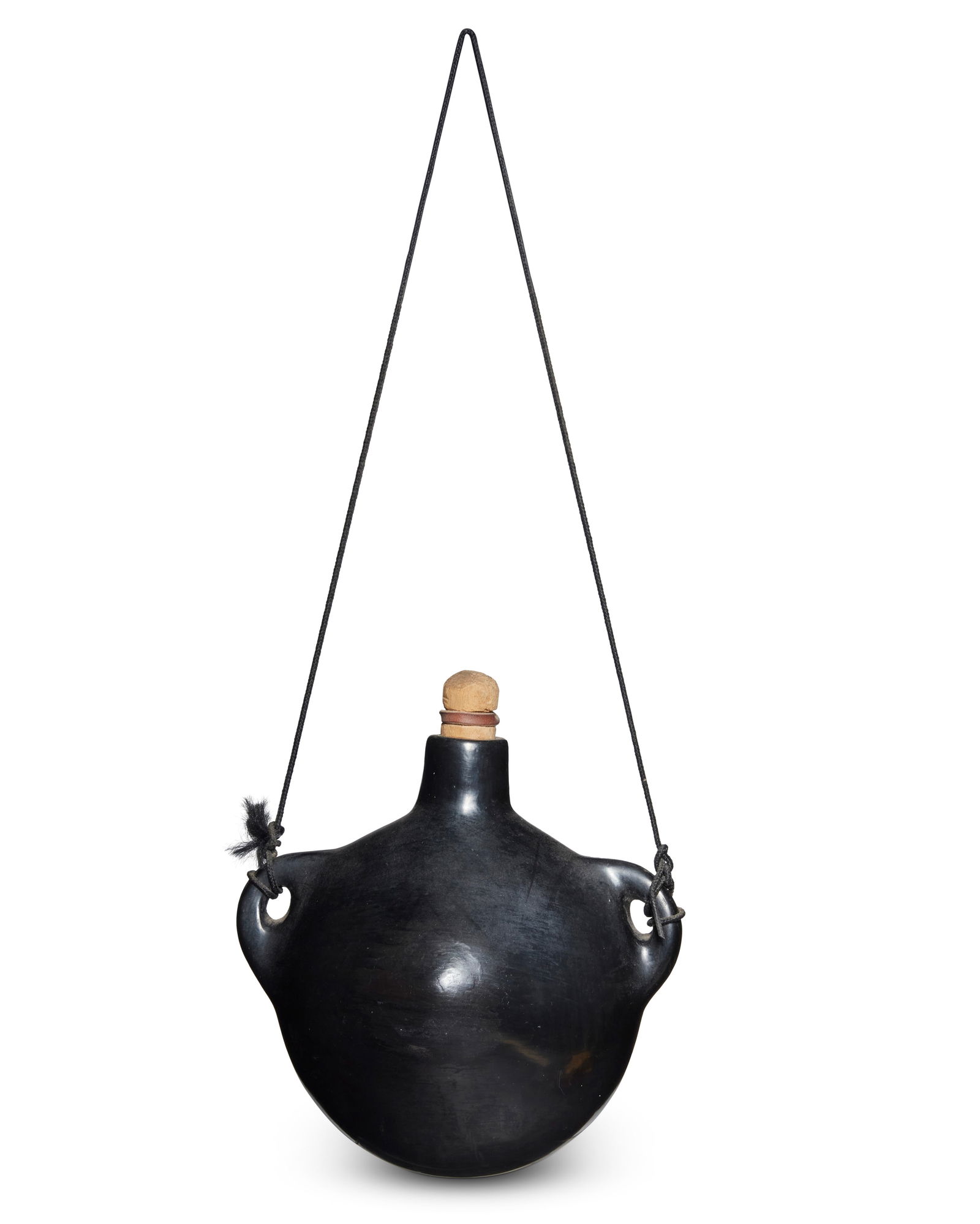 Rose Cata Gonzales (1900-1989, Ohkay Owingeh/San Ildefonso Pueblo): Rose Cata Gonzales (1900-1989, Ohkay Owingeh/San Ildefonso Pueblo)A San Ildefonso blackware pottery canteen, mid/late 20th centurySigned to base: RoseA large flat-backed canteen with peaked center and