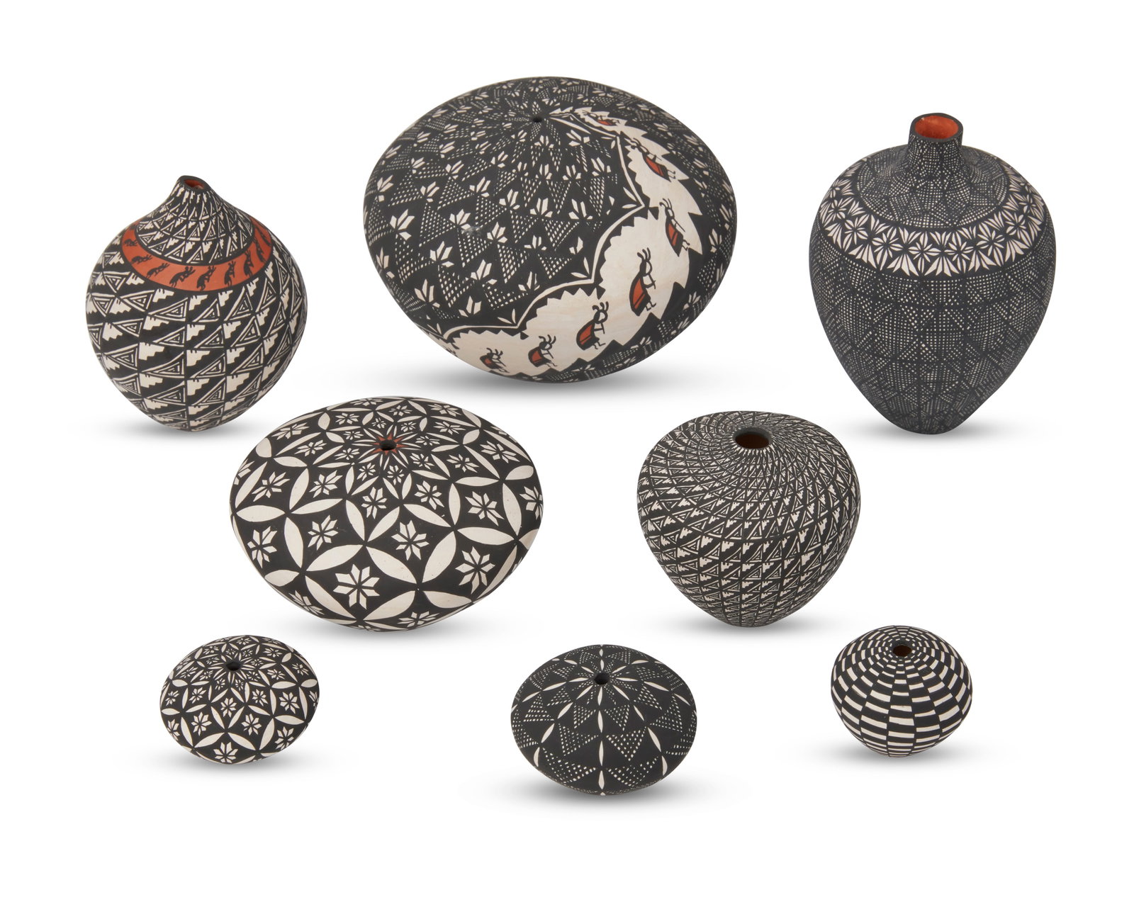 Sandra Victorino (b. 1958, Acoma Pueblo): Sandra Victorino (b. 1958, Acoma Pueblo) A group of small Acoma seed pots and a vase, late 20th/early 21st century Most signed: Sandra Victorino / Acoma NM; three signed: S. Victorino The black on whi