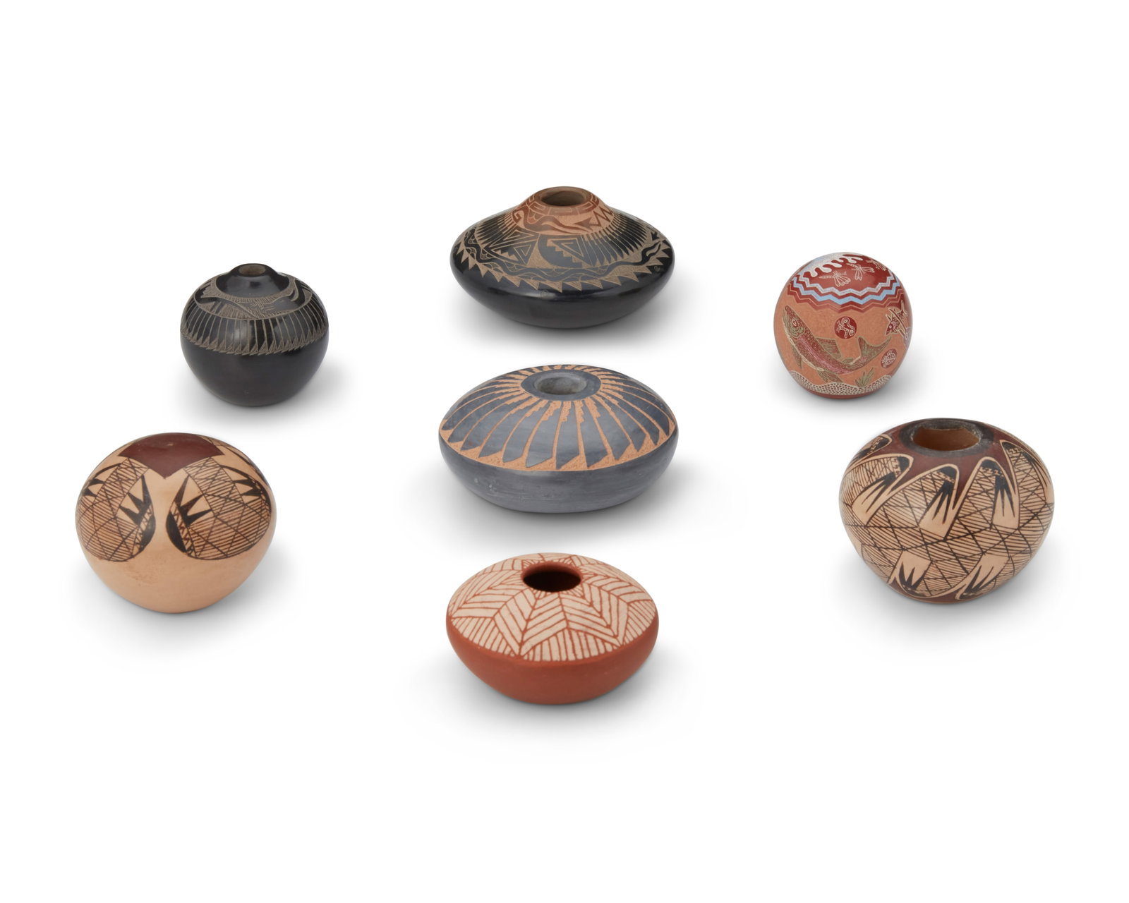 A group of diminutive Southwest pottery vessels: A group of diminutive Southwest pottery vessels Seven works: Nona Naha (1958-2021, Hopi-Tewa Pueblo) Two Hopi Pueblo seed pots, late 20th/early 21st century Each signed to underside: Nona Naha [corn c