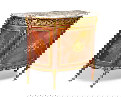 A transitional Louis XV/XVI-style marquetry demilune commode: A transitional Louis XV/XVI-style marquetry demilune commode20th centuryThe wood cabinet featuring marquetry veneer and mounted gilt-bronze trim and accents in egg-and-dart and scrolled laurel wreath
