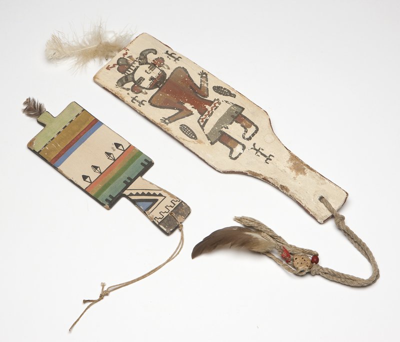 Two Hopi Kachina flat dance wands: 20th century, each polychrome decorated on both sides, the first: depicting a corn dancer (12.5'' H x 3.5'' W); the second: with rainbow-colored horizontal stripes (8.5'' H x 3'' W), 2 pcs, est:$300/5