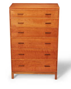 A Stickley Metropolitan tall chest: A Stickley Metropolitan tall chest Circa 1990s With "piecrust" logo burn mark to interior of top drawer: Stickley The cherry wood six-drawer dresser, the top revealing three divided