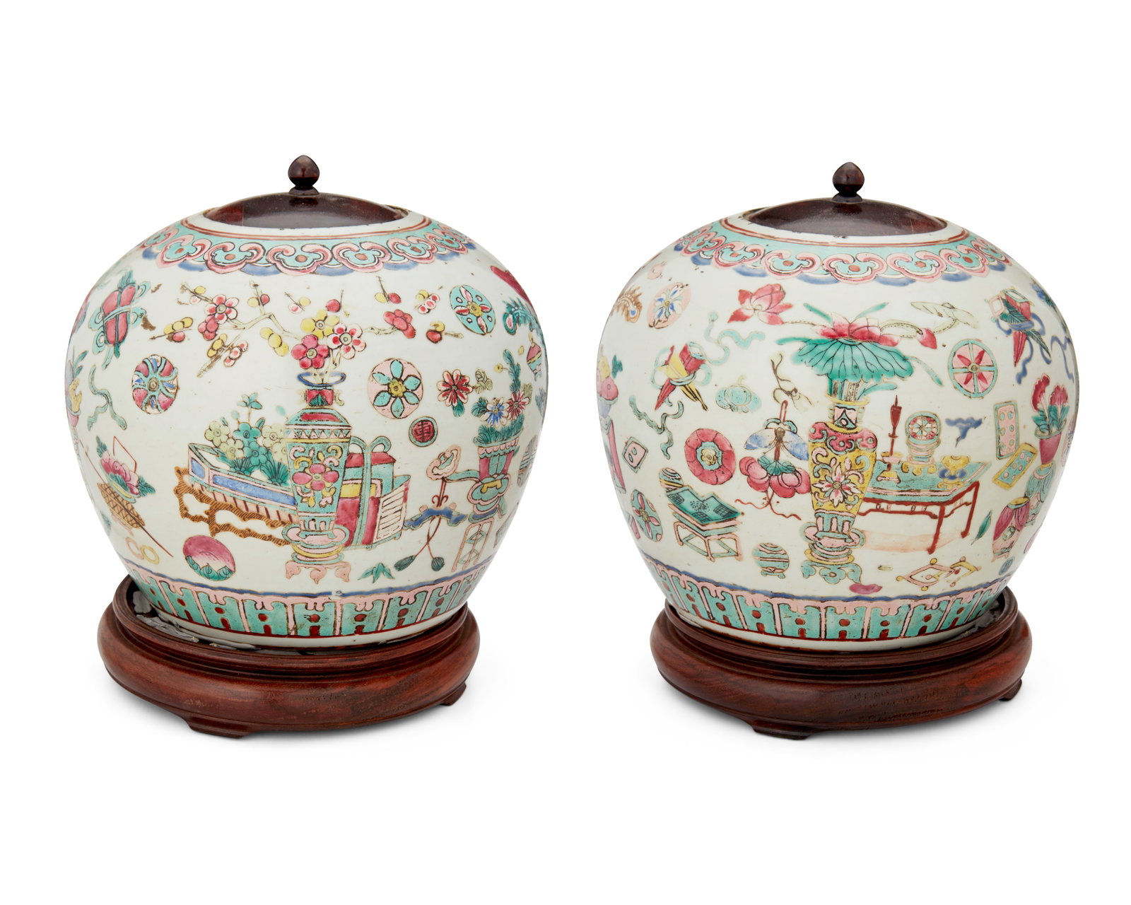A pair of Chinese Famille Rose porcelain ginger jars: A pair of Chinese Famille Rose porcelain ginger jars Late Qing Dynasty (1636-1912) or later Each appears unmarked Each ceramic vessel with enameled decoration depicting a continuous tableau of floral 