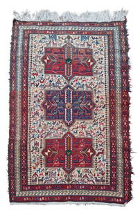 A small Caucasian area rug: A small Caucasian area rug20th centuryThe flat weave wool-on-cotton rug with polychrome pictorial aulian motifs surrounding three central medallions on an ivory ground6' 11" H x 4' 7" W